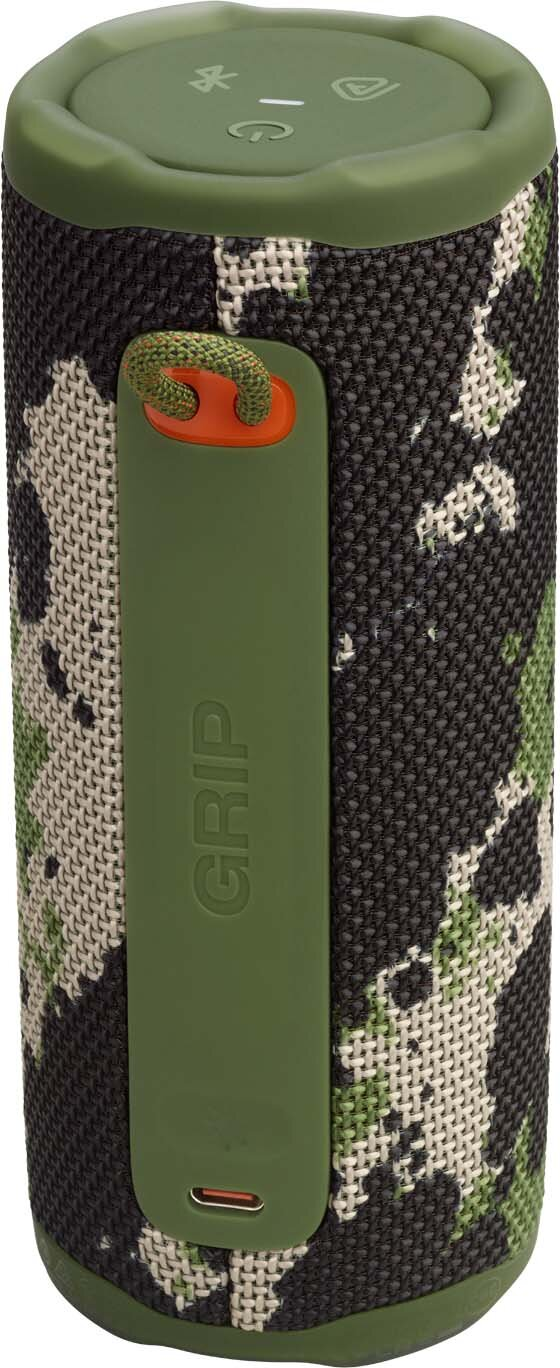 Cylindryczny głośnik z kamuflażem, zielonym uchwytem i górą. Widoczny napis 'GRIP'.