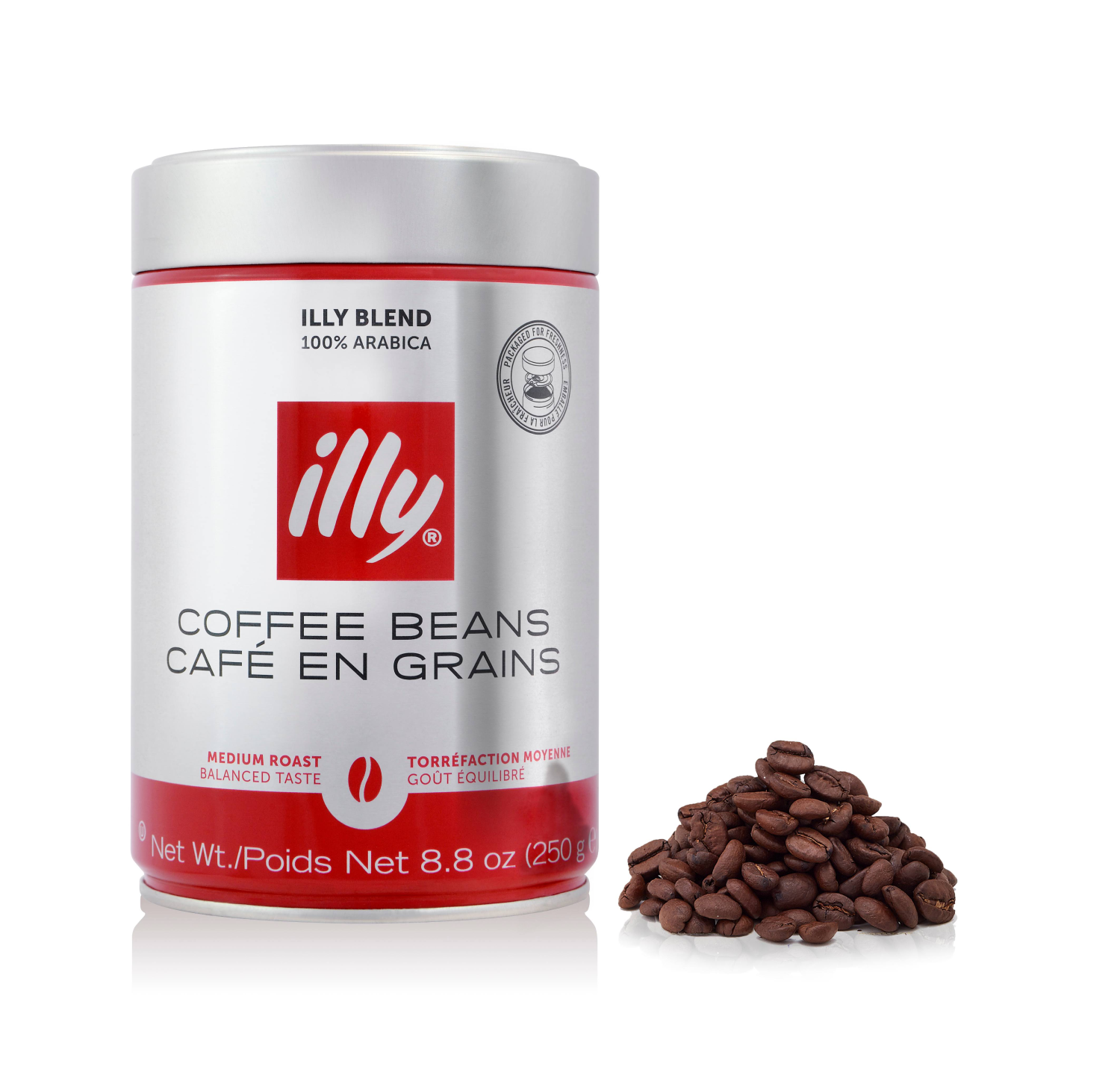Una lata de granos de café Illy con un montón de granos a la derecha. La lata es plateada y roja, y dice 'Granos de café'.