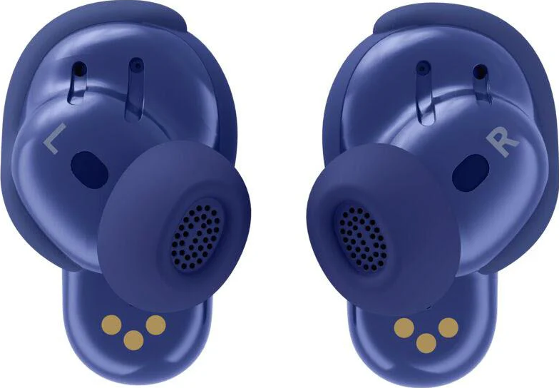 Deux écouteurs sans fil bleus, étiquetés L et R, avec un haut-parleur perforé. Des points dorés sont visibles au bas de chaque écouteur.