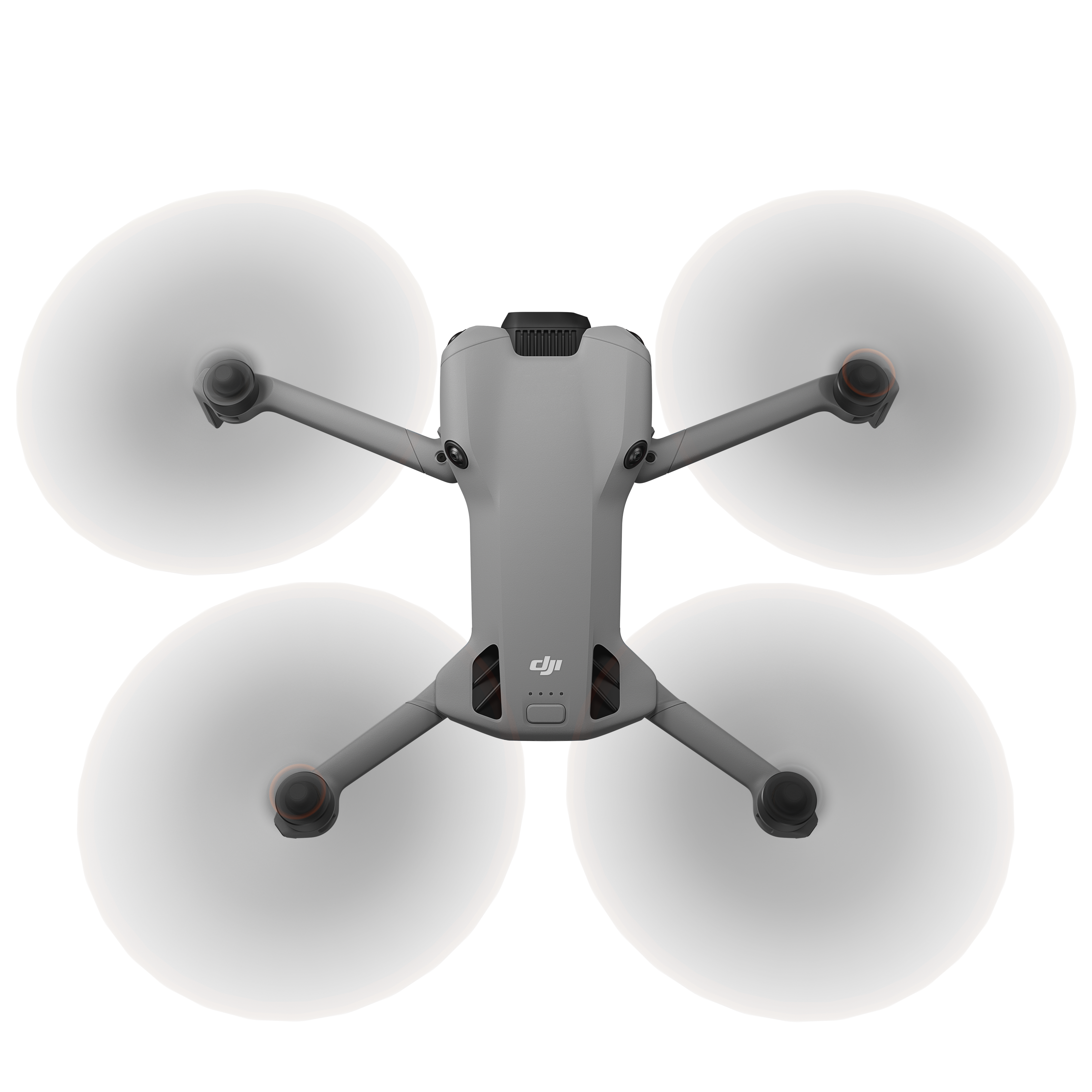 Egy szürke drón, forgó fehér propellerekkel, fehér háttér előtt. DJI logó és piros részletek láthatók.