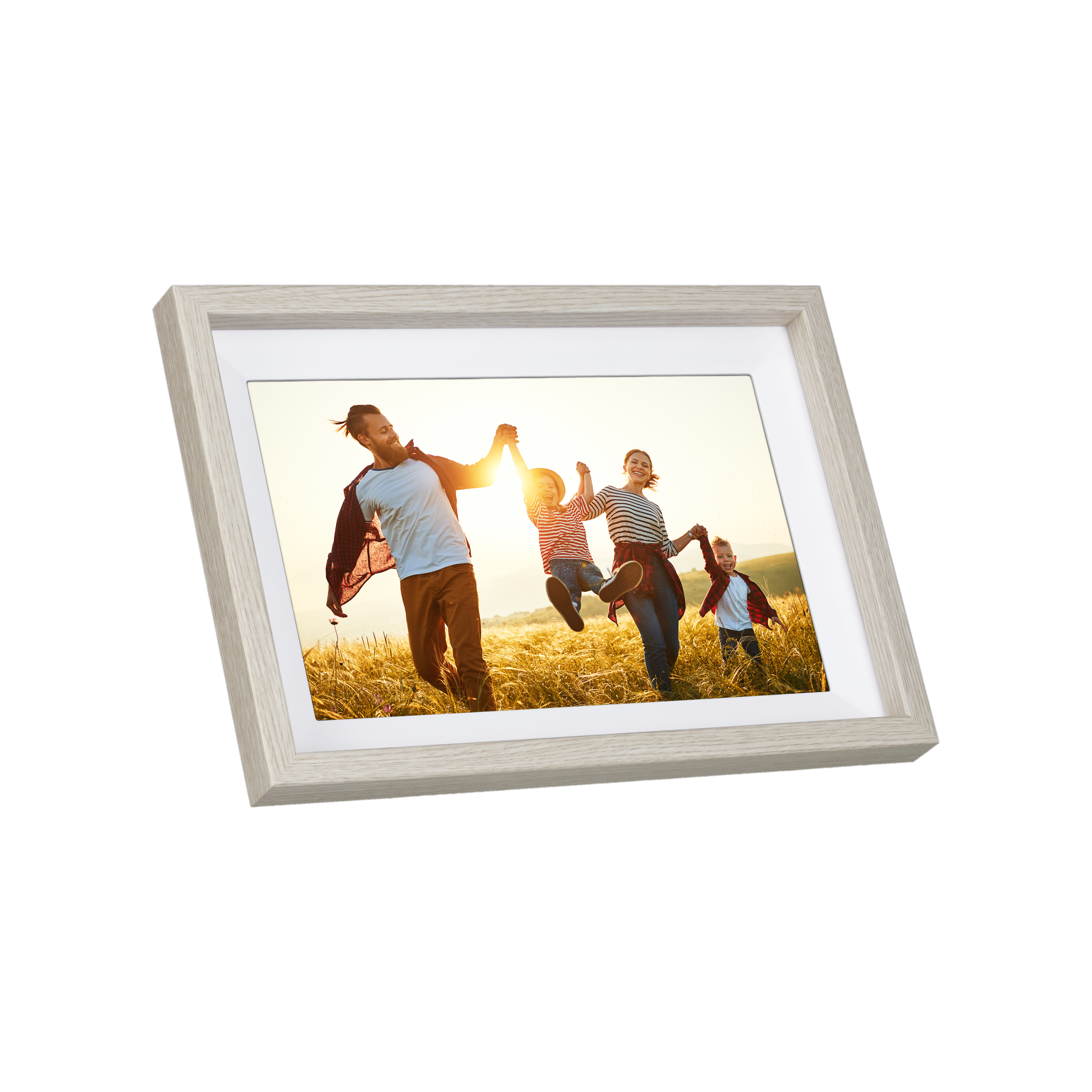 Ein gerahmtes Foto zeigt eine springende Familie in einem Feld. Der Rahmen ist hellgrau.