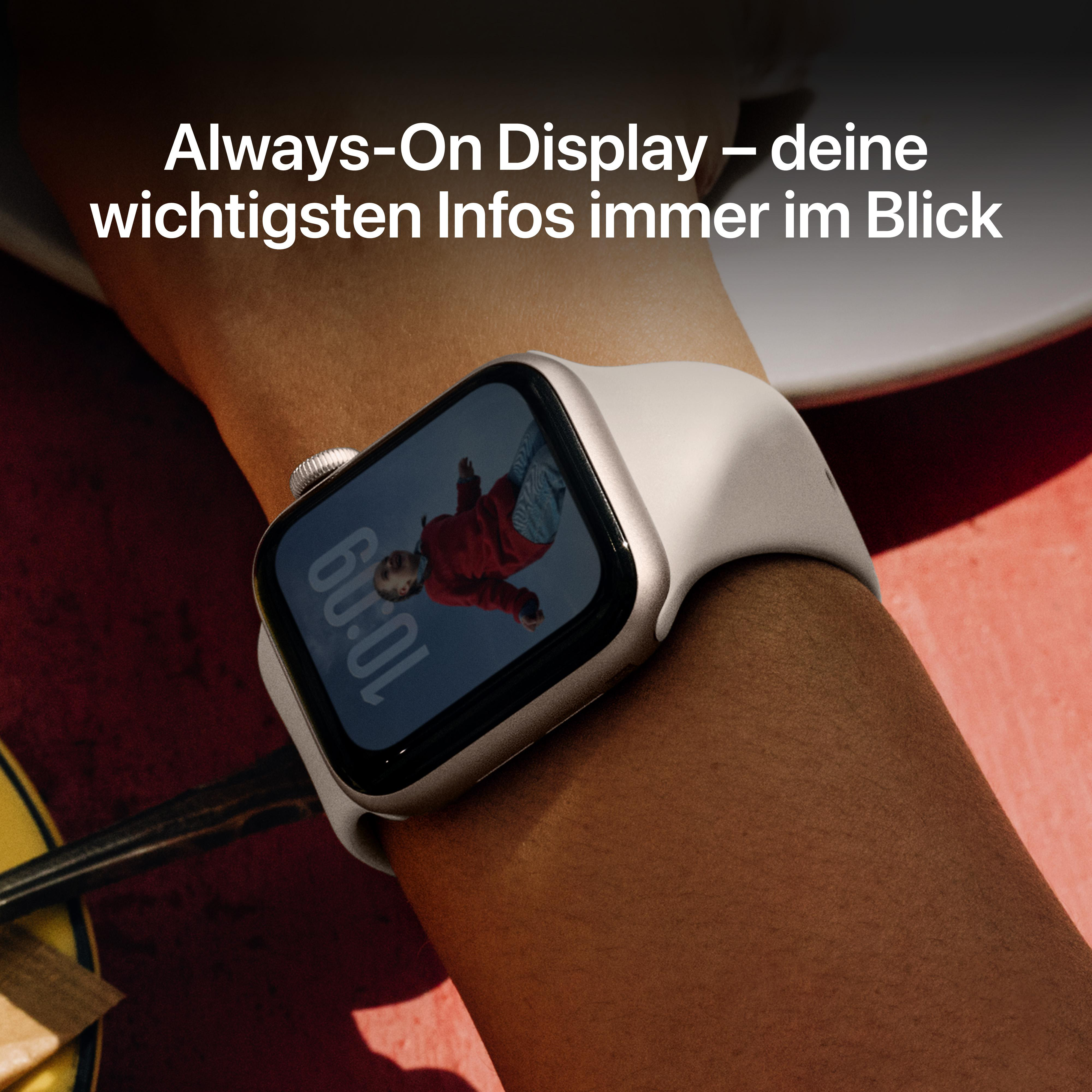 Ein Arm mit einer Uhr, die eine Person, Uhrzeit und Datum anzeigt. Die Uhr hat ein weißes Armband.
