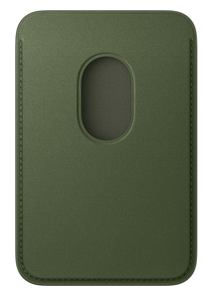 Zielony skórzany etui na karty. Ma centralny owalny otwór i przeszytą obwódkę. Tło jest gładkie.