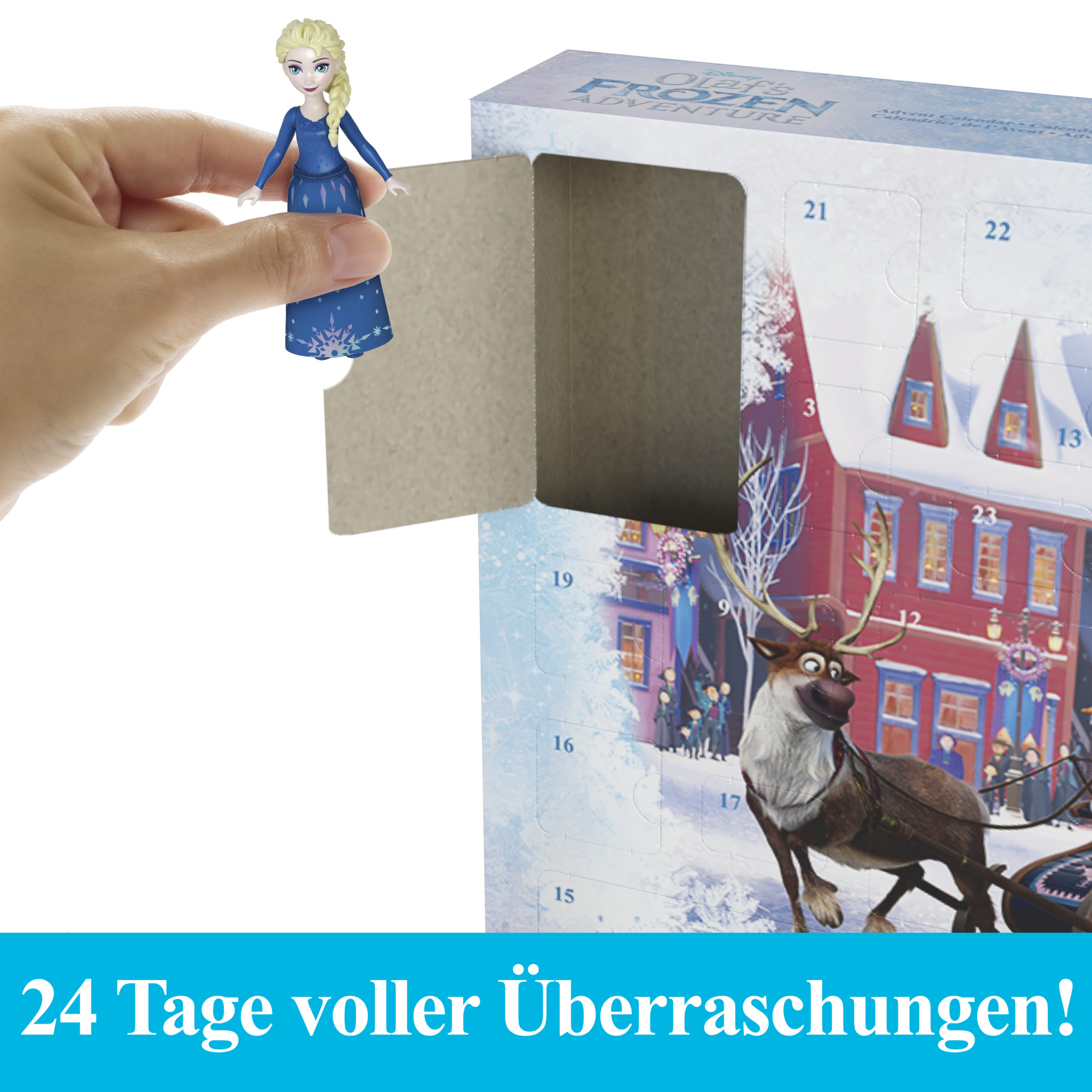 Hand hält Elsa-Figur aus Frozen, in der Nähe eines Adventskalenders. Kalender zeigt einen Rentier-Schlitten und Gebäude.