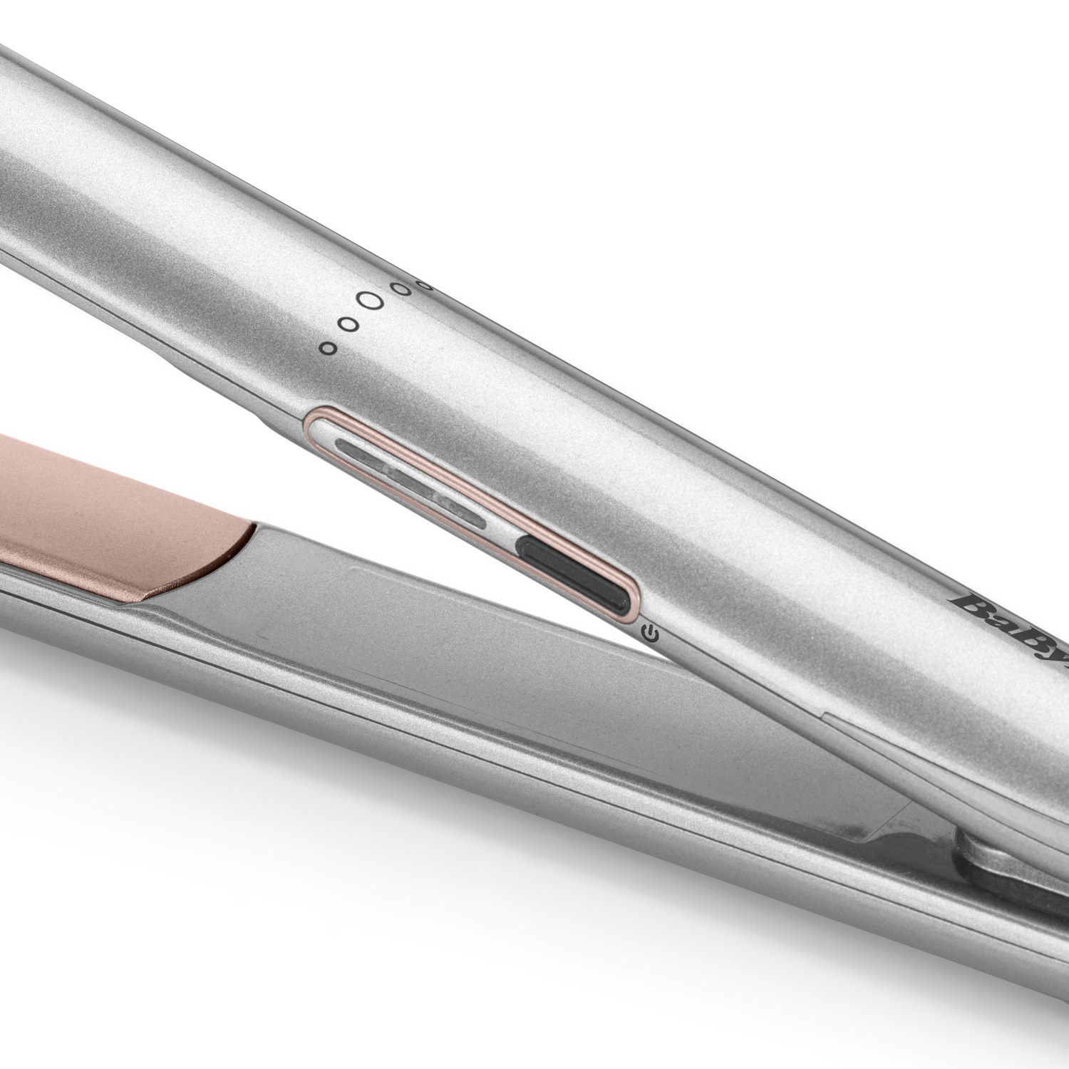 Close-up of a silver hair straightener with a rose gold plate. It has power and temperature buttons. The background is white.