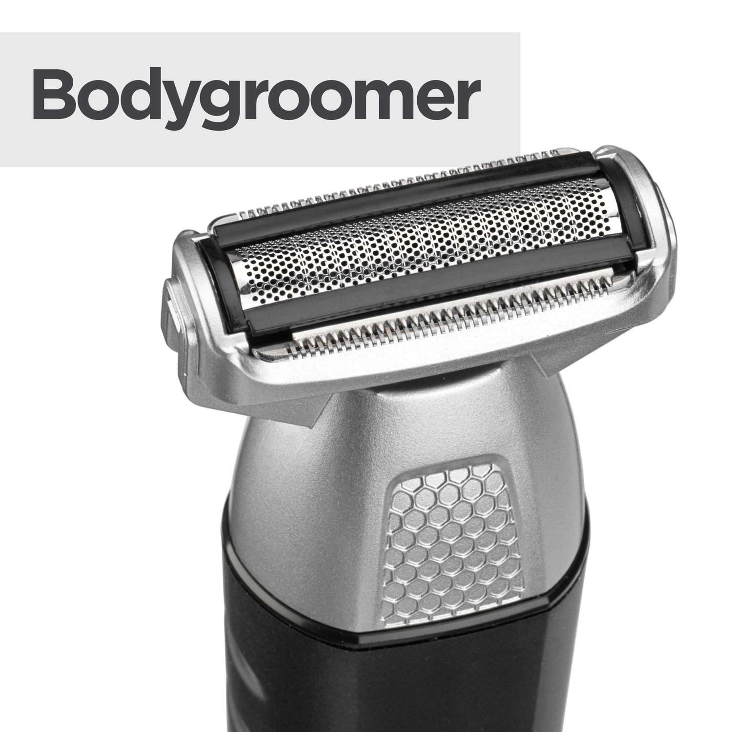 Close-up of a bodygroomer. The metal head has a mesh and blades. The body is silver with a black base and honeycomb design.