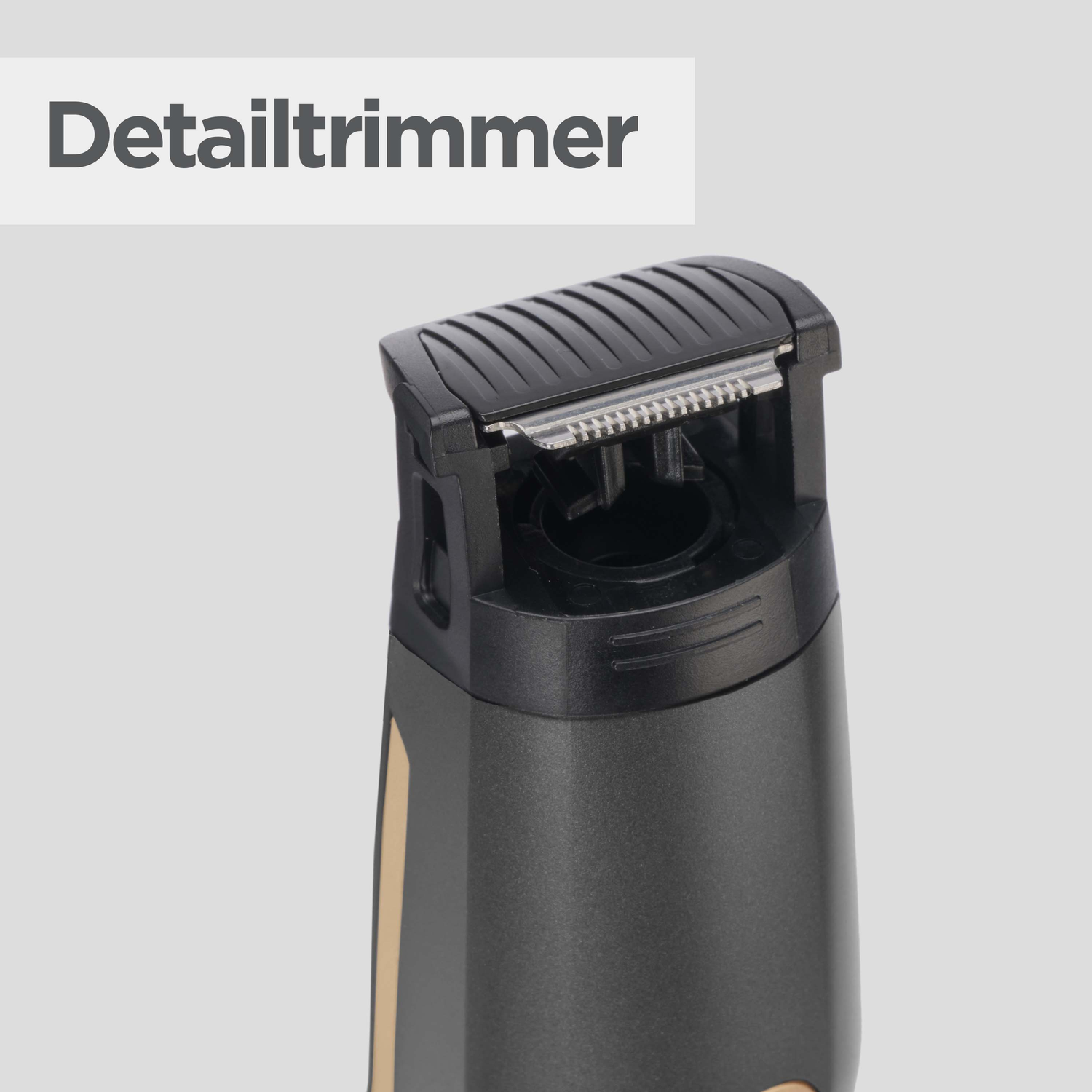 Close-up of a detail trimmer. Black head with silver blades. Dark gray body with a beige stripe. The word 'Detailtrimmer' is above.