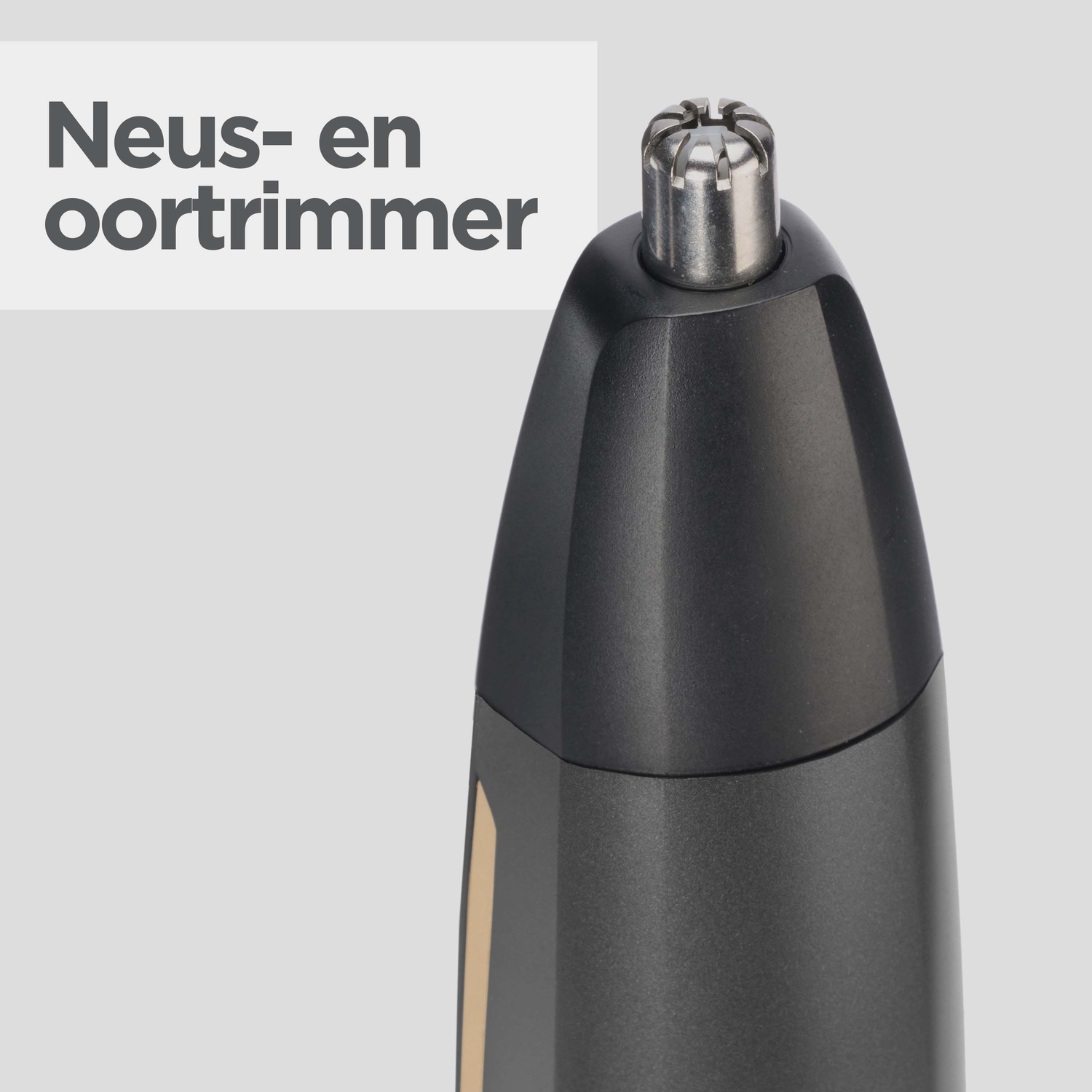 Close-up of a black and silver nose and ear hair trimmer. The top is silver with small openings. The text 'Neus- en oortrimmer' is visible.