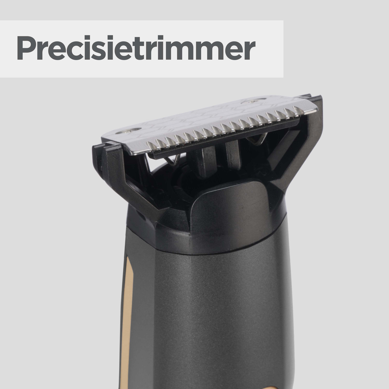 A close-up of a precision trimmer. The trimmer has a silver blade, black plastic body, and a grey handle with a gold stripe.
