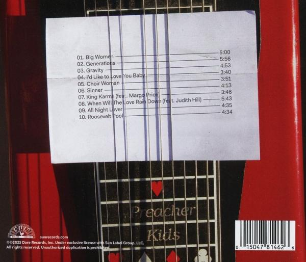 Eine rote Gitarre mit einem weißen Papier, auf dem Songtitel stehen. Die Worte "Preacher Kids" sind zu sehen.