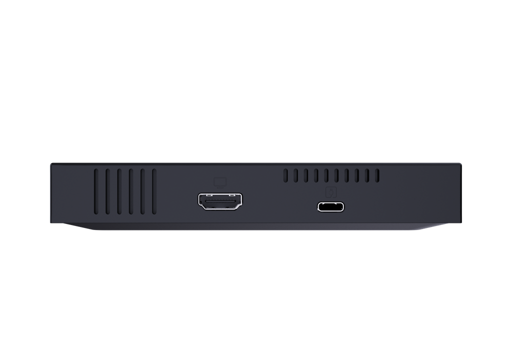 Primer plano de un dispositivo negro con puertos. Se ven puertos HDMI y USB-C, junto con ranuras de ventilación.
