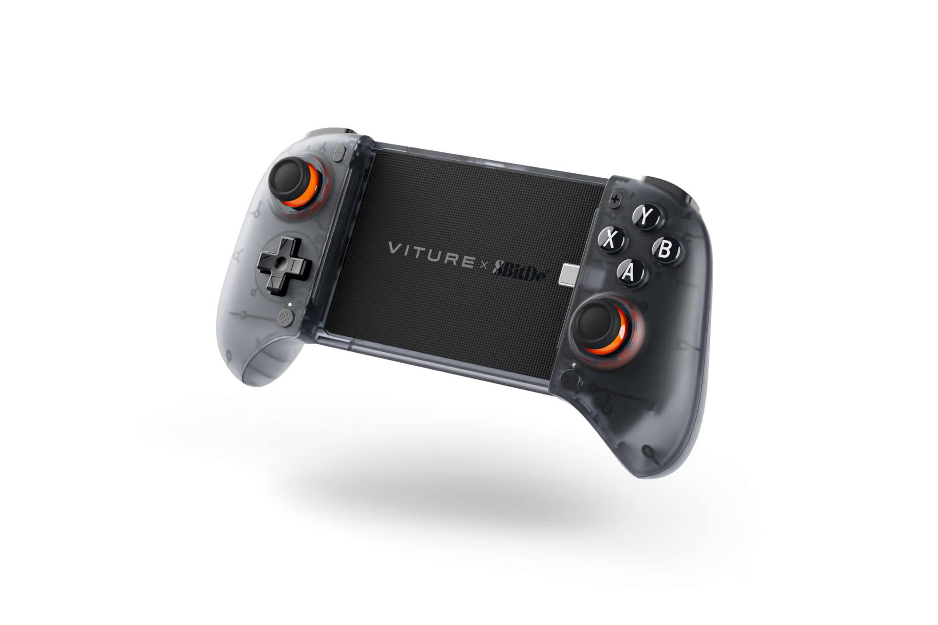 Ein transparent grauer Gamecontroller mit schwarzen Knöpfen und einem schwarzen Mittelteil, das Design umfasst orangefarbene Akzente.