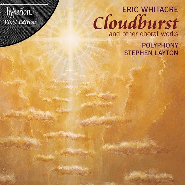Albumcover mit warmem, goldgelbem Hintergrund. Titel: Cloudburst. Künstler: Eric Whitacre. Mit Wolken und hellem Licht.