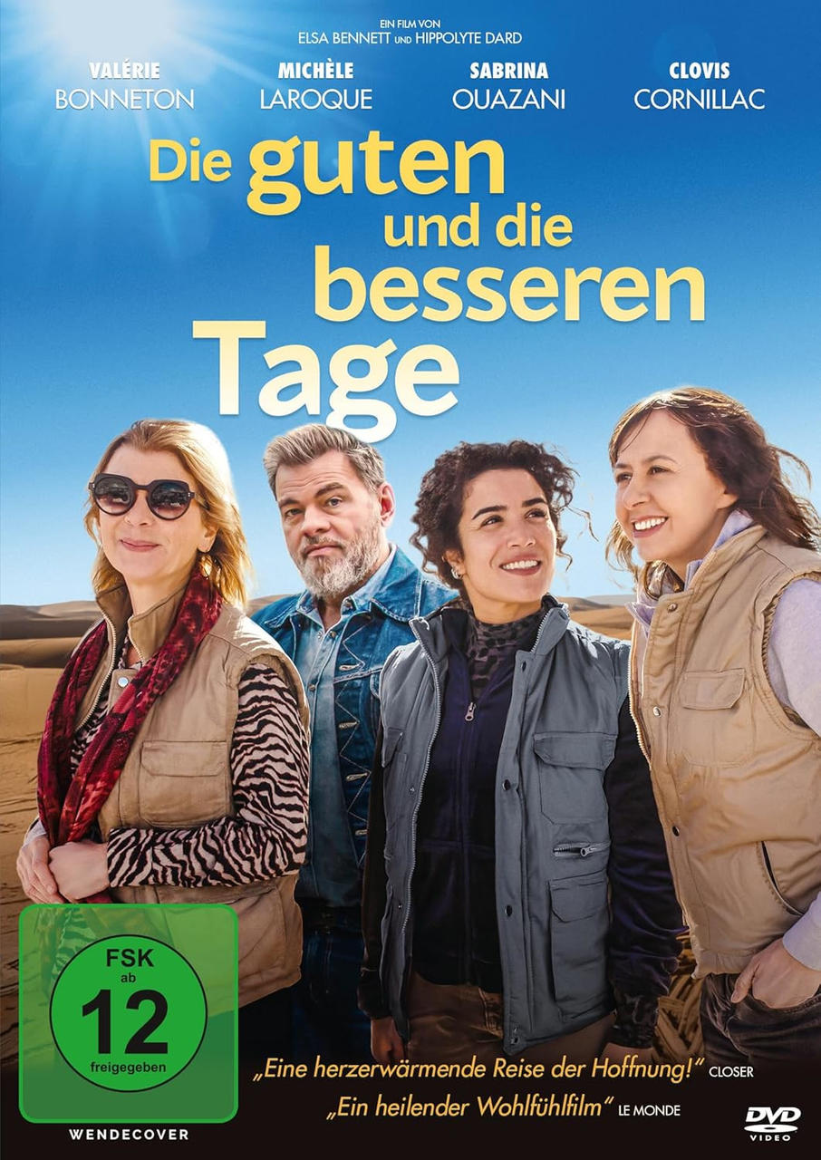 Vier Personen stehen in einer Wüstenlandschaft. Filmplakat.