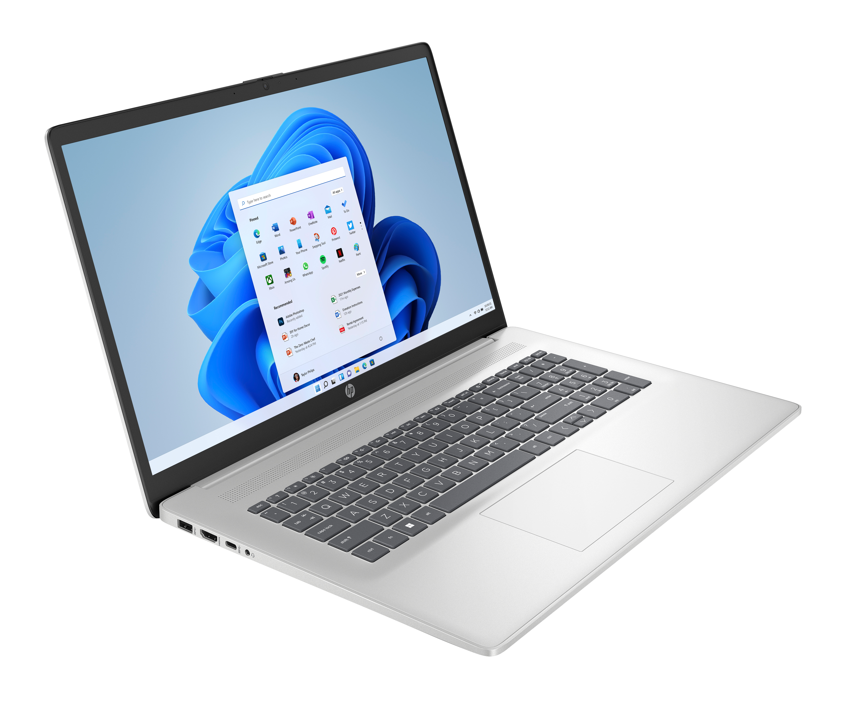 Srebrny laptop na czarnym tle, widoczny interfejs Windows 11. Klawiatura i touchpad również widoczne.