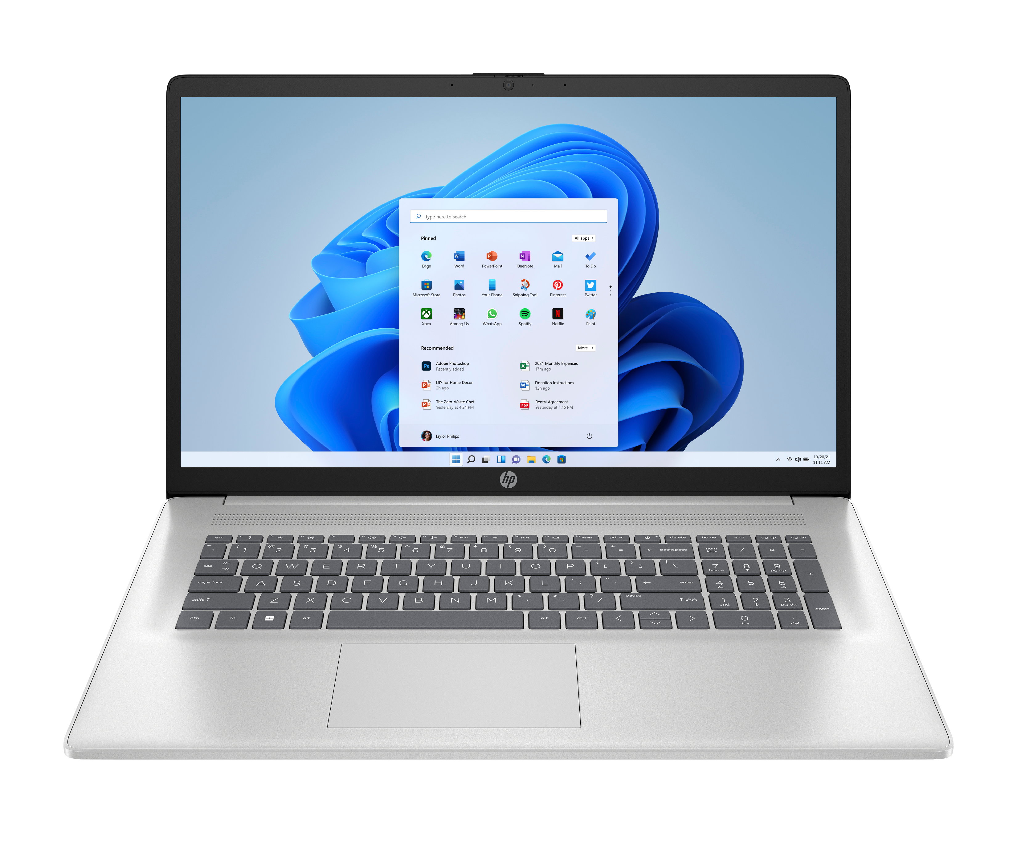 Srebrny laptop wyświetla interfejs Windows 11. Klawiatura jest widoczna.