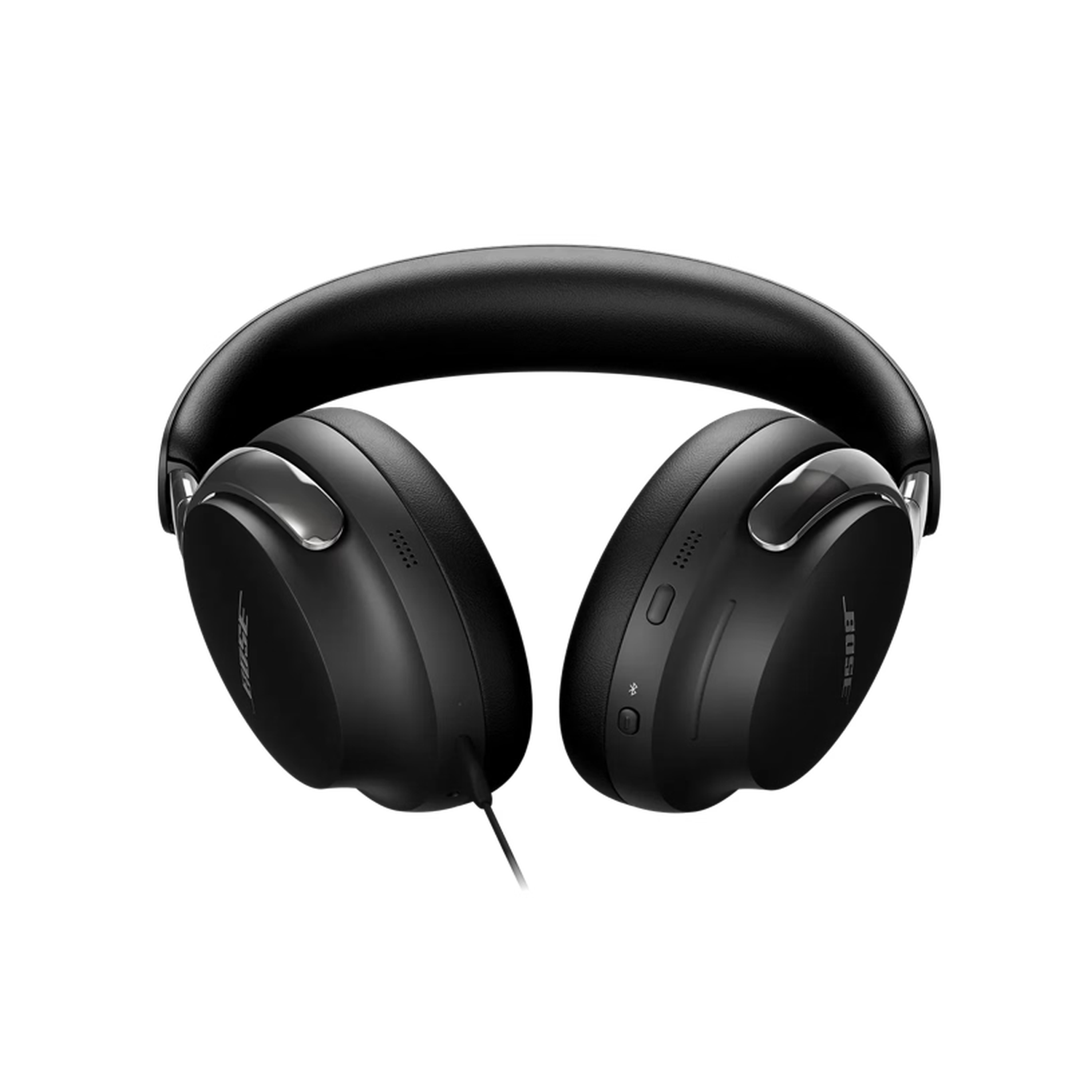 Casque Bose noir sur fond noir. Le casque est de type circum-auriculaire avec un arceau et des coussinets rembourrés.