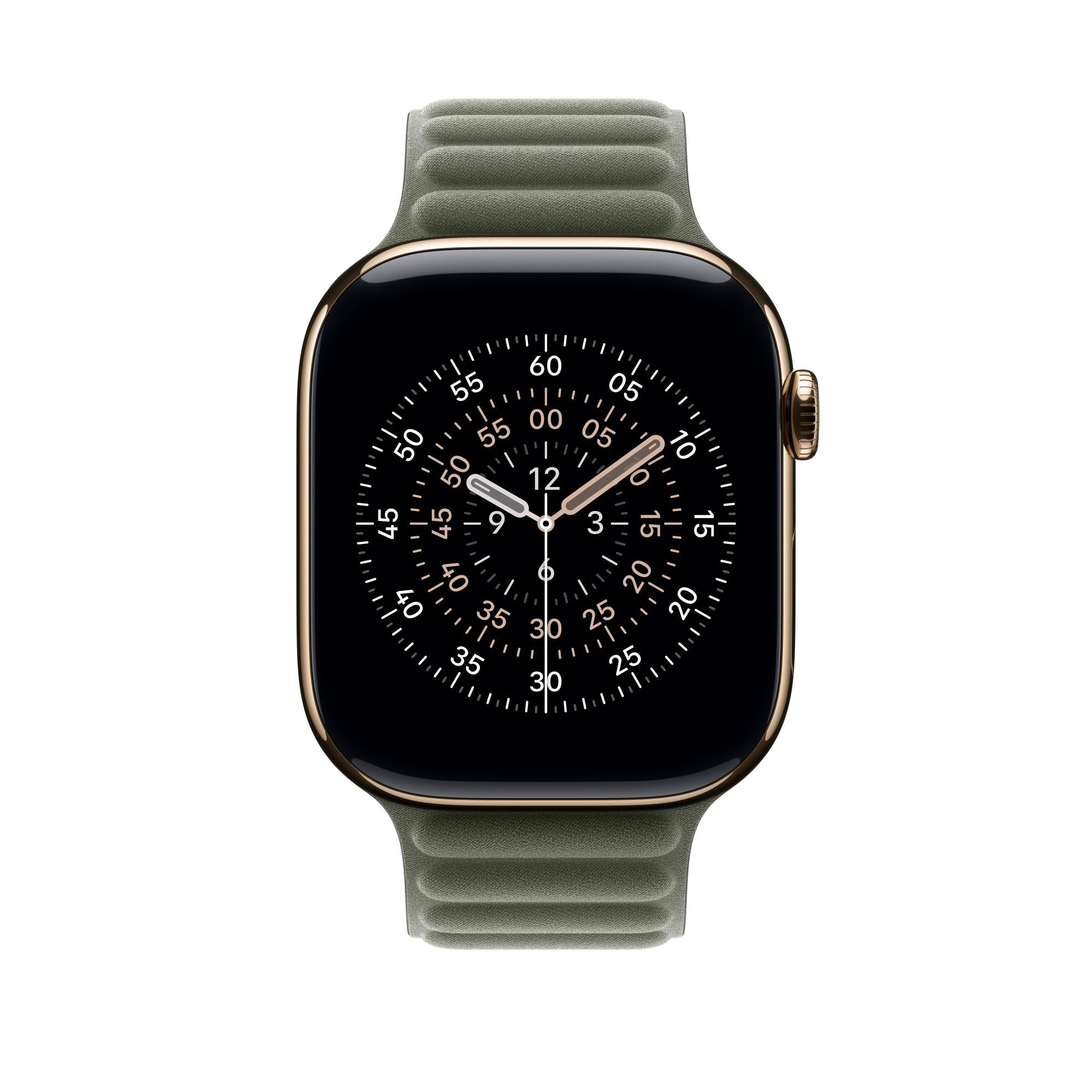 Eine goldene Apple Watch mit grünem Armband zeigt ein Zifferblatt. Die Uhr zeigt die Zeit 2:56 Uhr an.