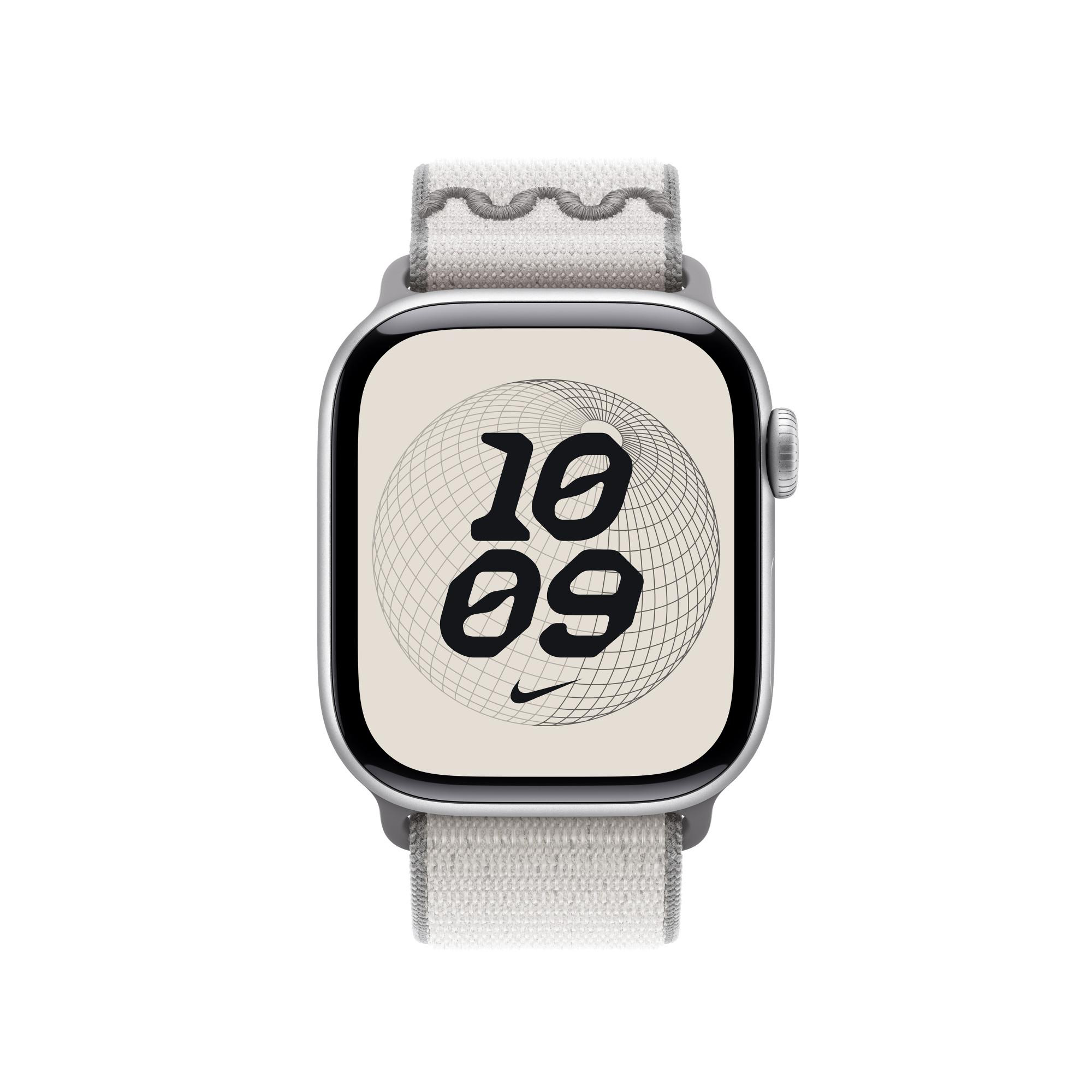Apple Watch Nike-Edition. Silbernes Gehäuse, beiges Zifferblatt mit schwarzen Zahlen 10:09. Graues Armband mit weißem Wellenmuster.