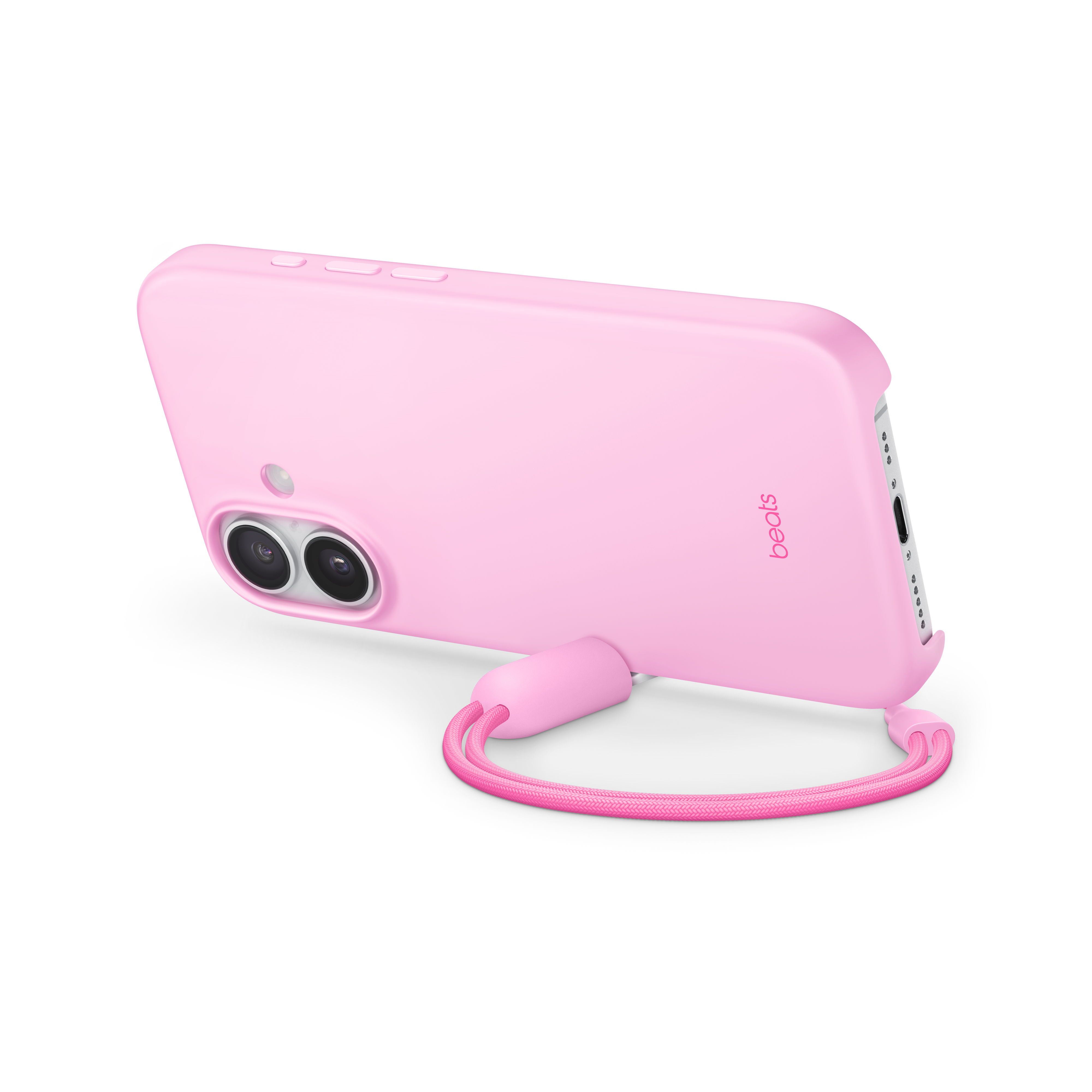 Coque de téléphone rose avec lanière sur fond noir. Logo 'Beats' visible. Le téléphone a deux caméras.