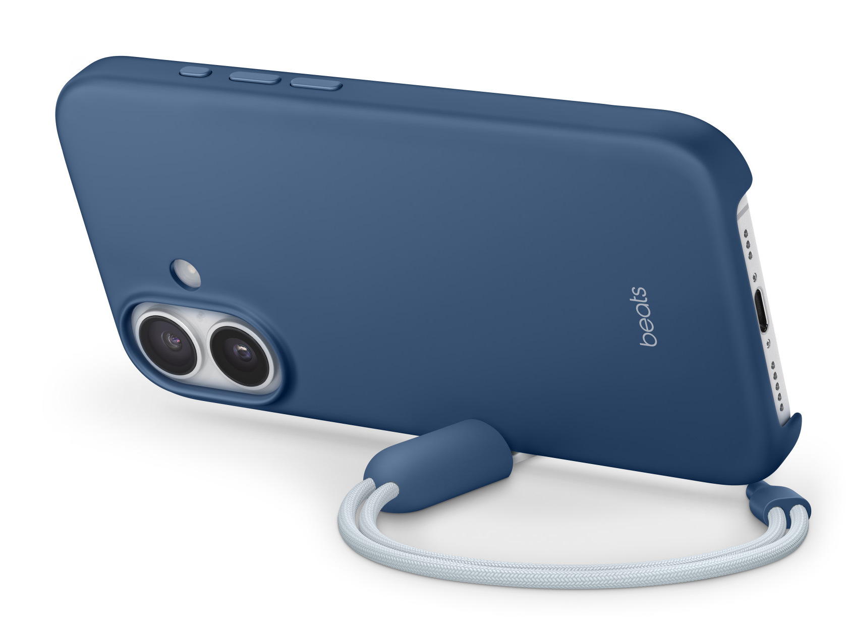 Niebieskie etui na telefon z białym paskiem. Ma napis 'beats' i aparat z dwoma obiektywami. Etui leży na białej powierzchni.