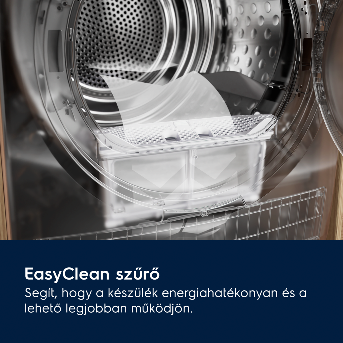 A mosógép belsejének közeli képe, amely egy szűrőt és a dobot mutatja. A gép fémből van, átlátszó ajtóval.