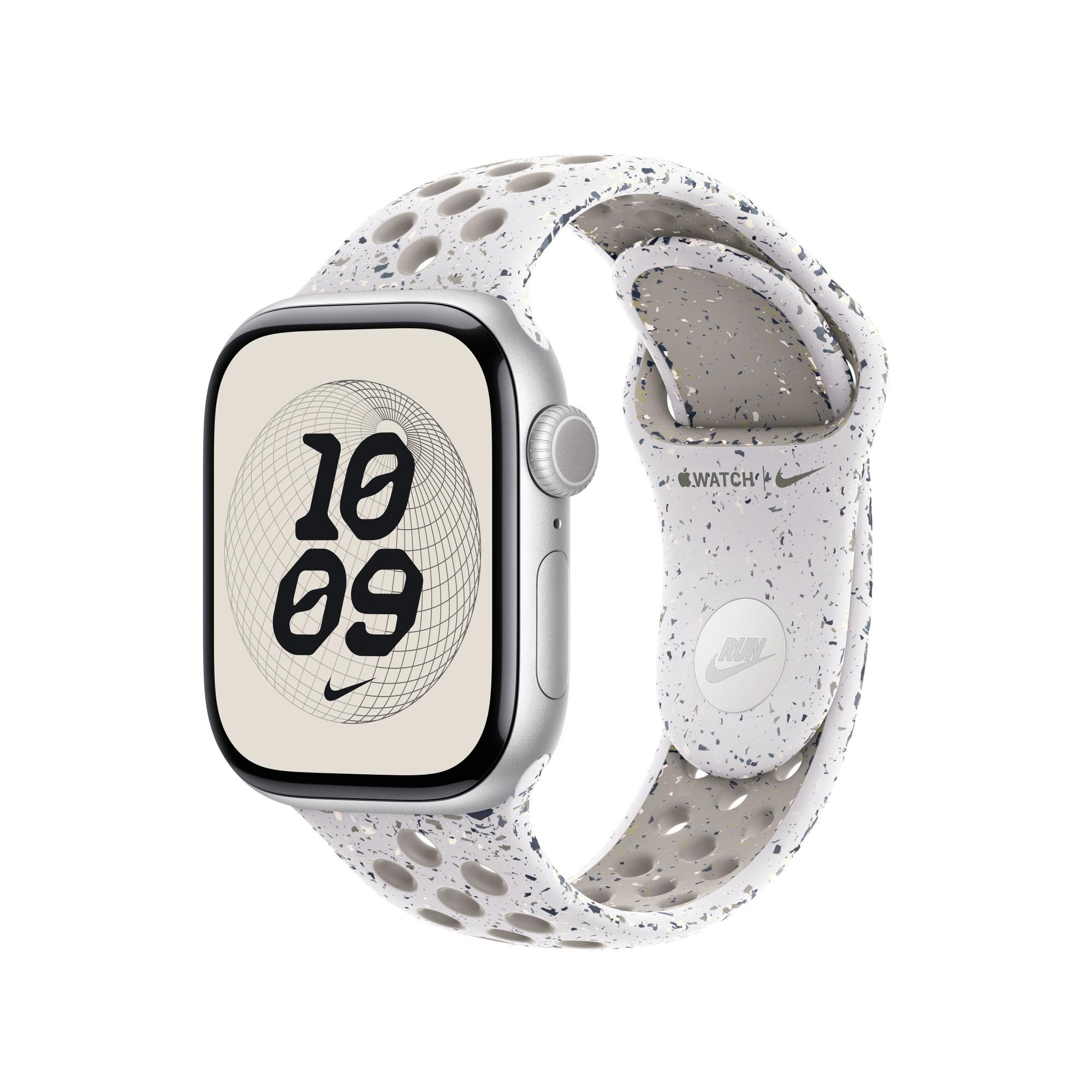 Silberne Apple Watch mit gesprenkeltem weißen Armband. Das Zifferblatt zeigt die Uhrzeit 10:09 mit einem Nike-Logo.