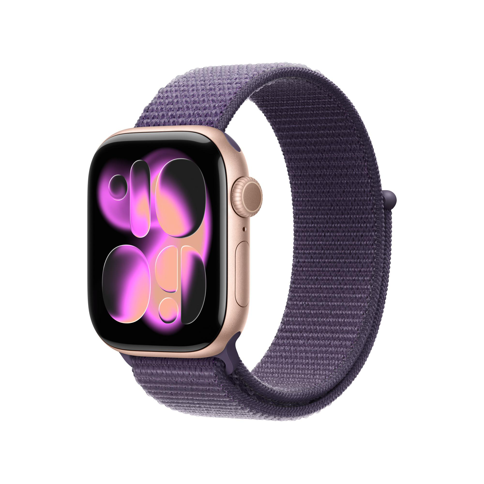 Eine goldene Apple Watch mit einem lila Stoffband. Das Zifferblatt zeigt einen rosa-orangenen Farbverlauf.