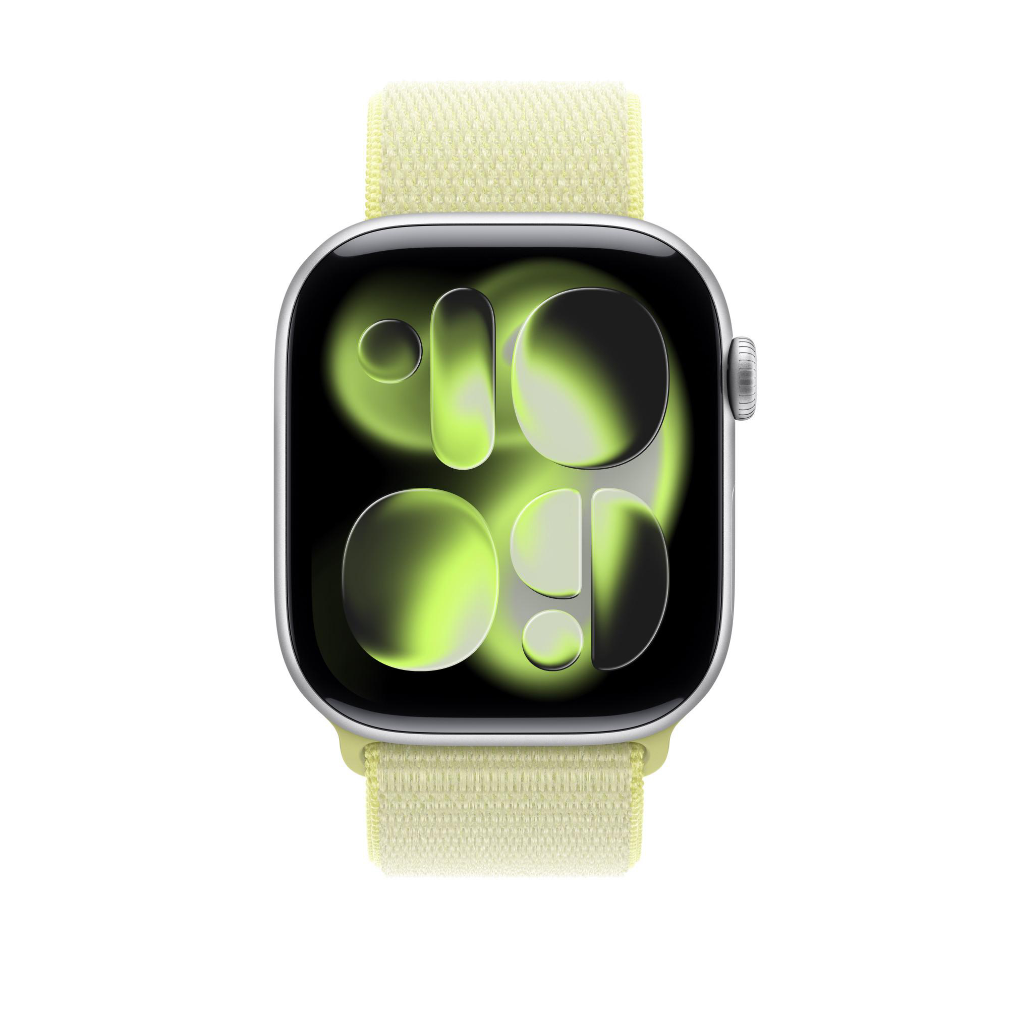 Apple Watch mit hellgelbem Armband. Zifferblatt zeigt grüne, abstrakte Zahlen und Formen.