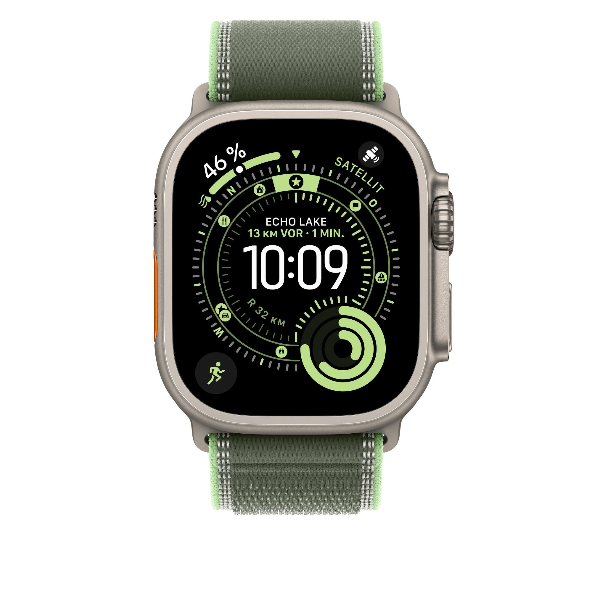 Eine Smartwatch mit grünem Armband zeigt die Uhrzeit 10:09, 46 % Akku und Standortdaten an. Die Uhr ist silber und schwarz.