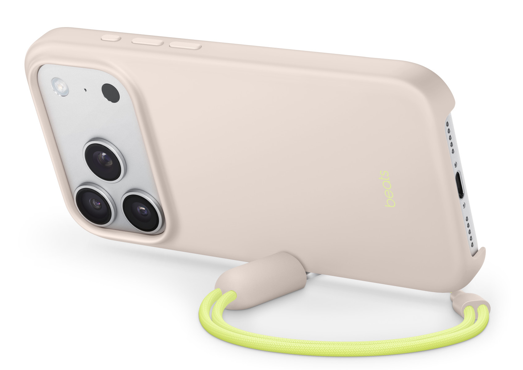 Jasnoróżowe etui na telefon z neonowo-zielonym paskiem. Telefon ma trzy aparaty. Widoczne logo Beats.