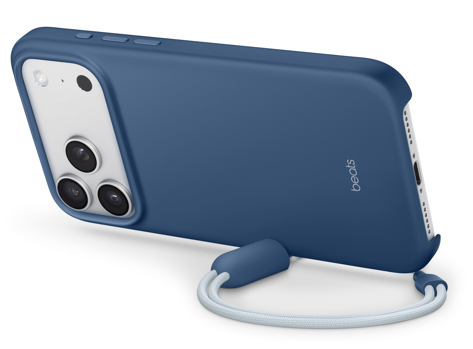 Niebieskie etui na telefon z białymi obiektywami aparatu i białym paskiem. Widoczne logo Beats.