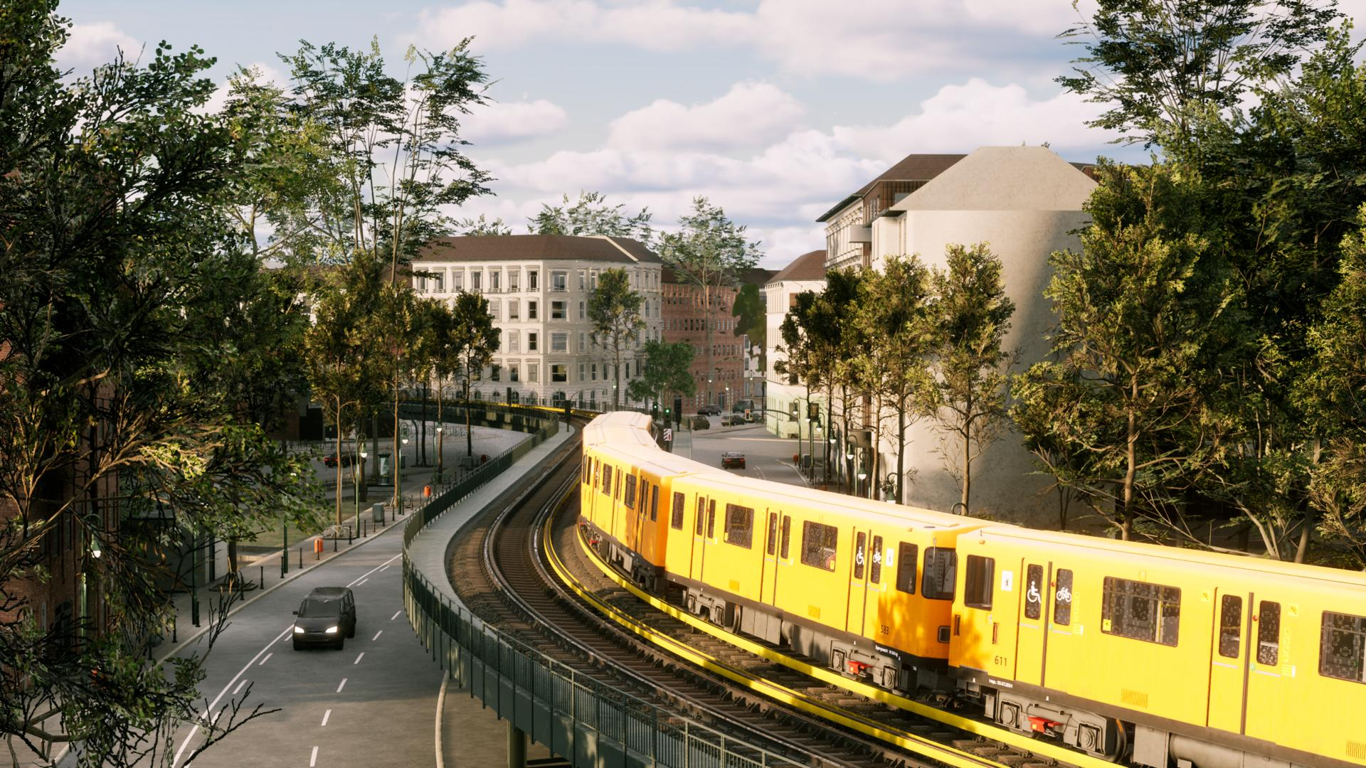 Ein gelber Zug fährt auf Schienen durch eine Stadt mit Bäumen und Gebäuden.