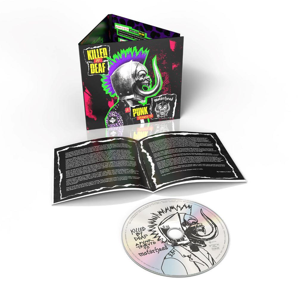 Albumcover mit Totenkopf, lila Irokesenschnitt und Text. CD mit passendem Artwork. Offenes Booklet mit Text. Weißer Hintergrund.