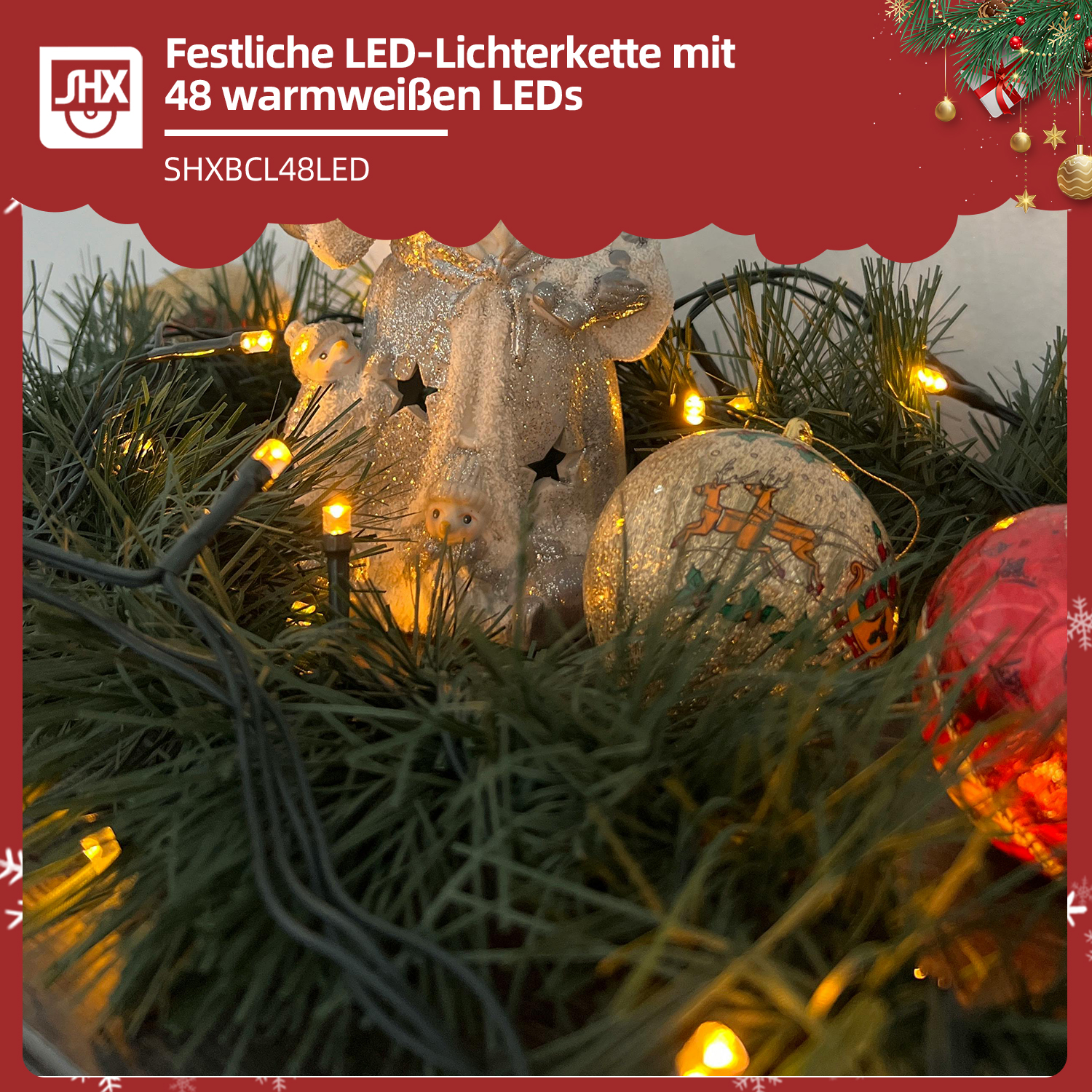 Weihnachtsdekoration mit LED-Lichtern, Ornamenten und einer Figur. Grüner Girlande mit warmen Lichtern und dekorativen Kugeln.