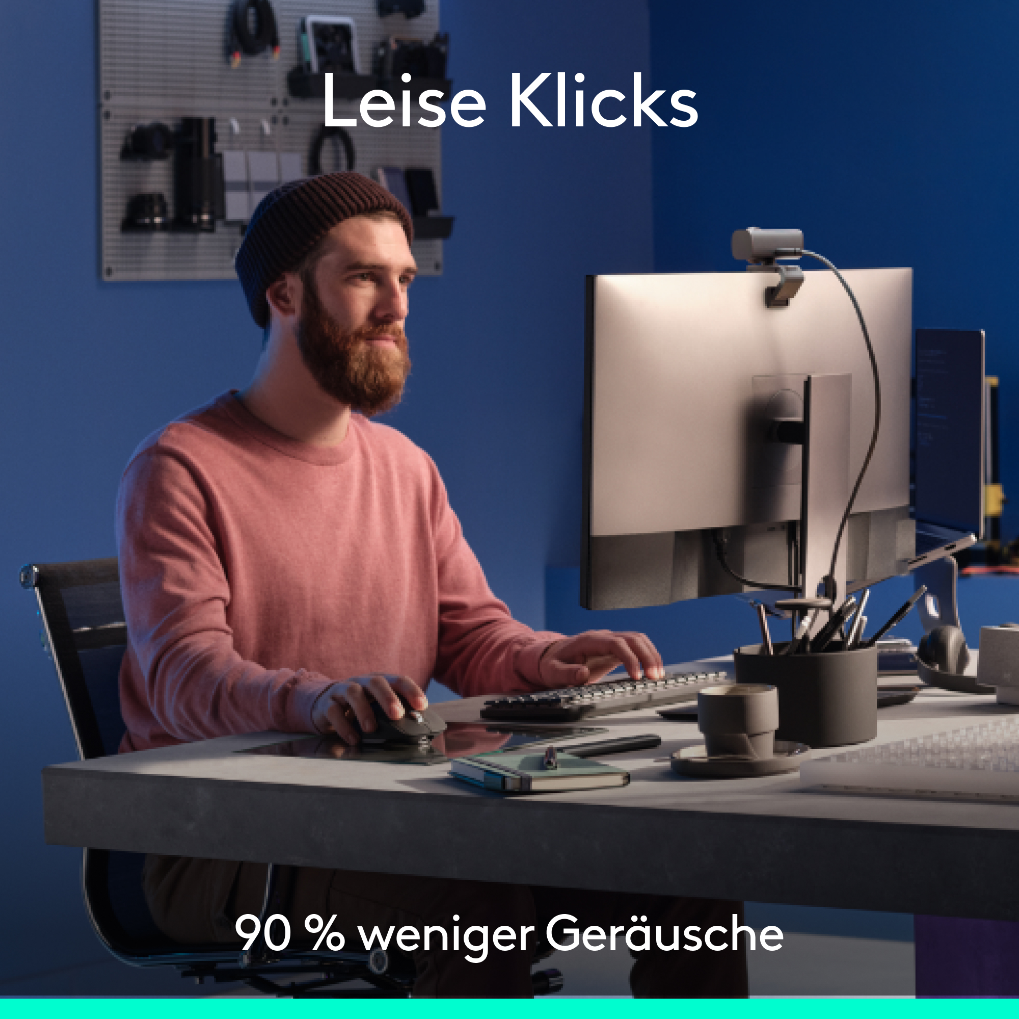 Mann, der an einem Computer arbeitet, trägt ein rosa Hemd. Text: 'Leise Klicks' und '90 % weniger Geräusche'.