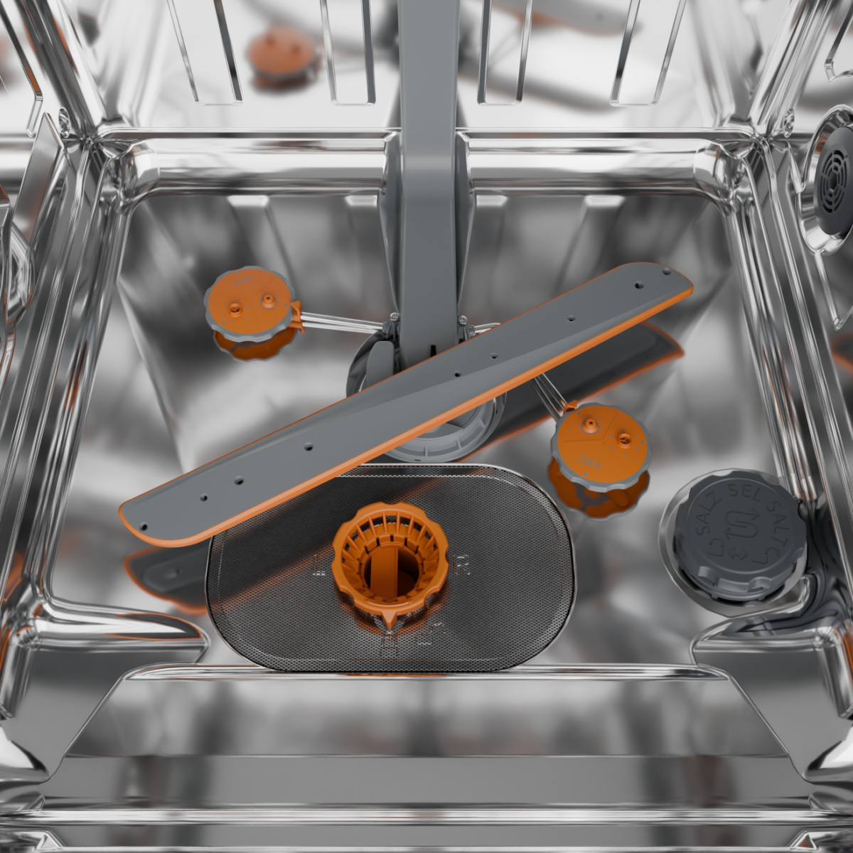 Wnętrze zmywarki. Widoczne są szare i pomarańczowe części, w tym ramiona natryskowe, filtr i pojemnik na sól.
