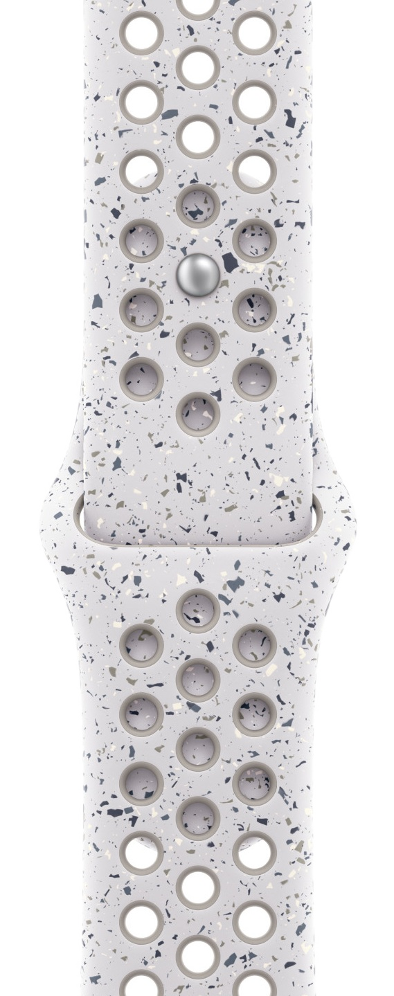 Zbliżenie białego paska do Apple Watch z otworami i wzorem szarych, niebieskich i beżowych plam. Widoczny srebrny trzpień.