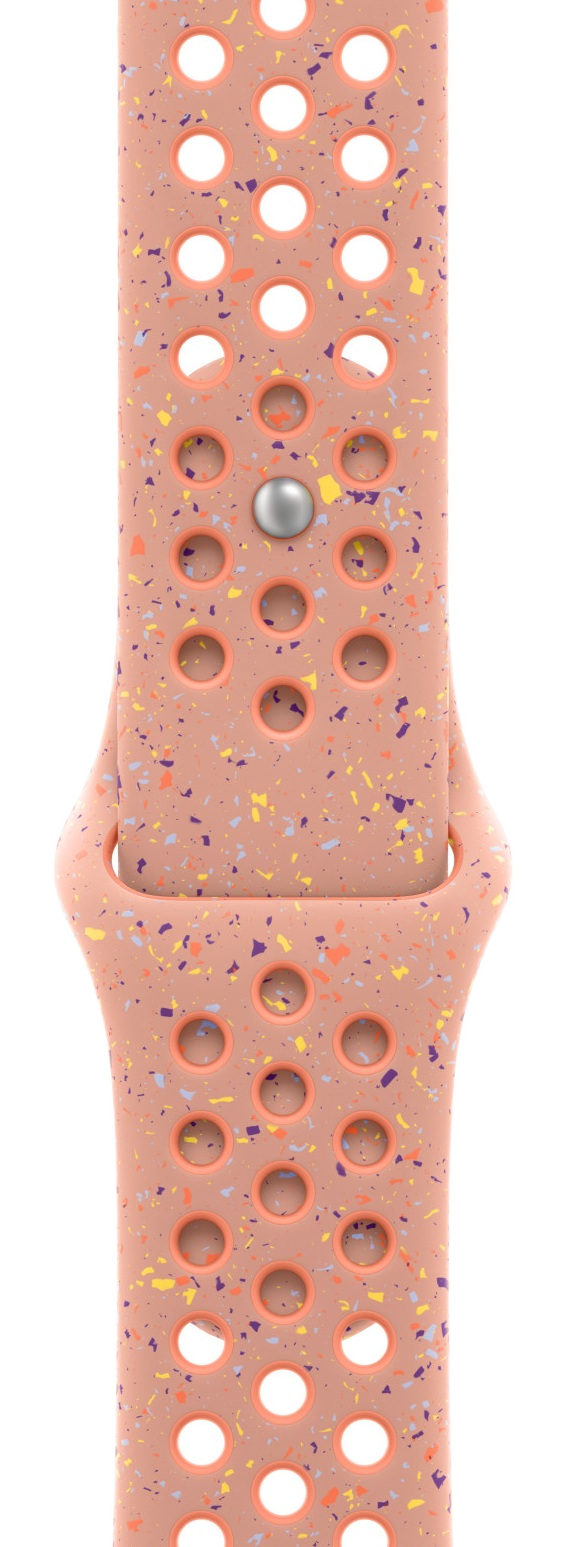 Różowy pasek do Apple Watch z otworami i kolorowymi plamkami. Srebrne zapięcie znajduje się pośrodku.