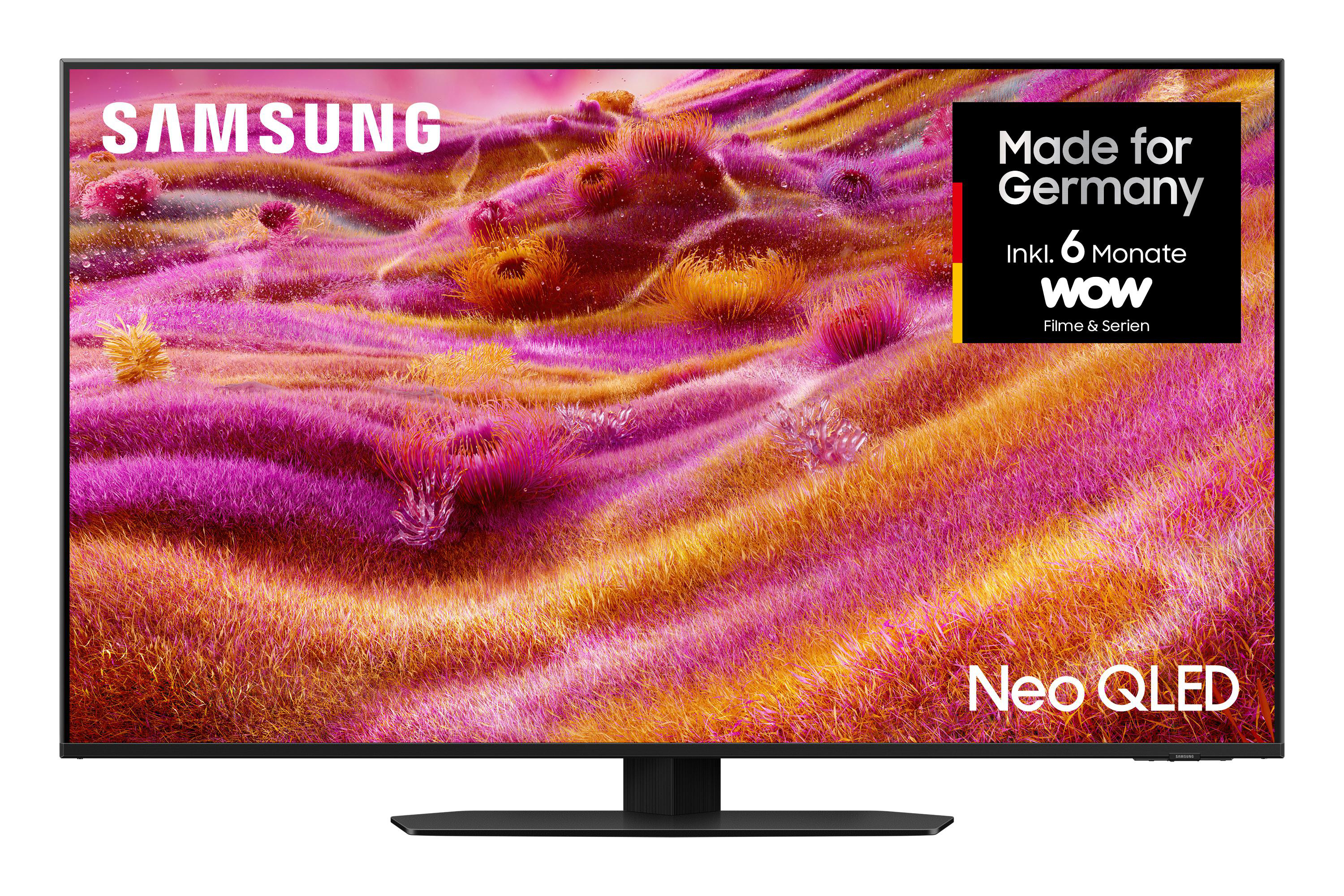 Samsung Neo QLED Fernseher. Bildschirm zeigt abstrakte Kunst in Pink, Gelb. Made in Germany Aufkleber rechts.