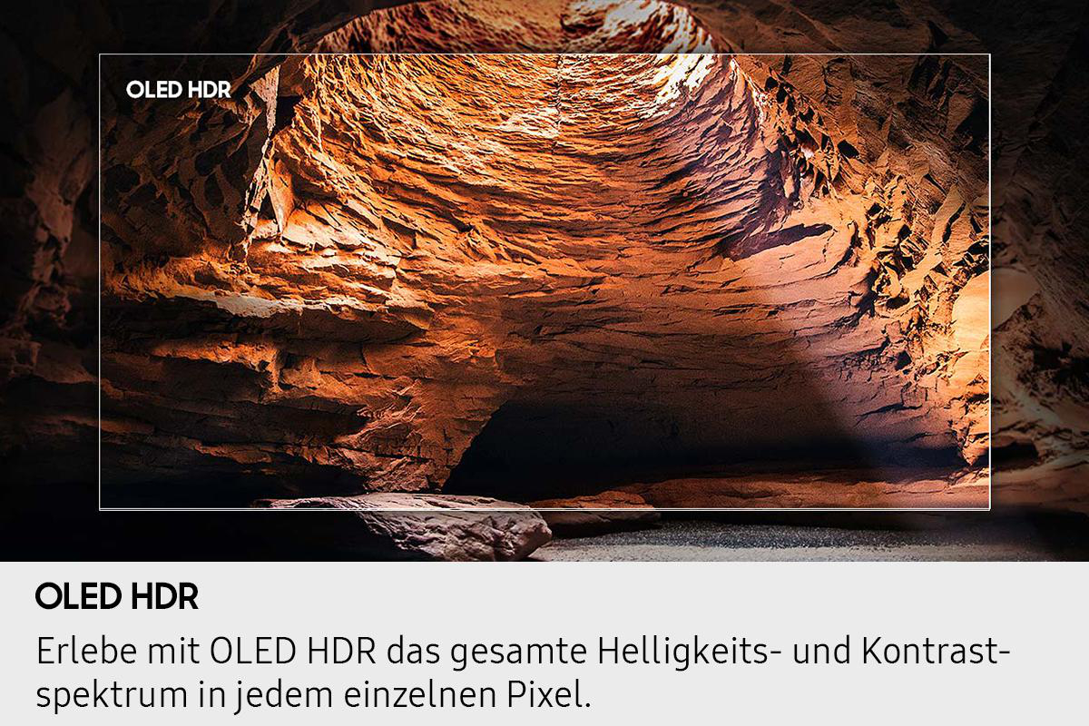 Ein OLED HDR-Display zeigt eine höhlenartige Struktur. Die Wände sind braun mit einem dunklen Schatten am Boden. Das OLED HDR-Logo ist oben.