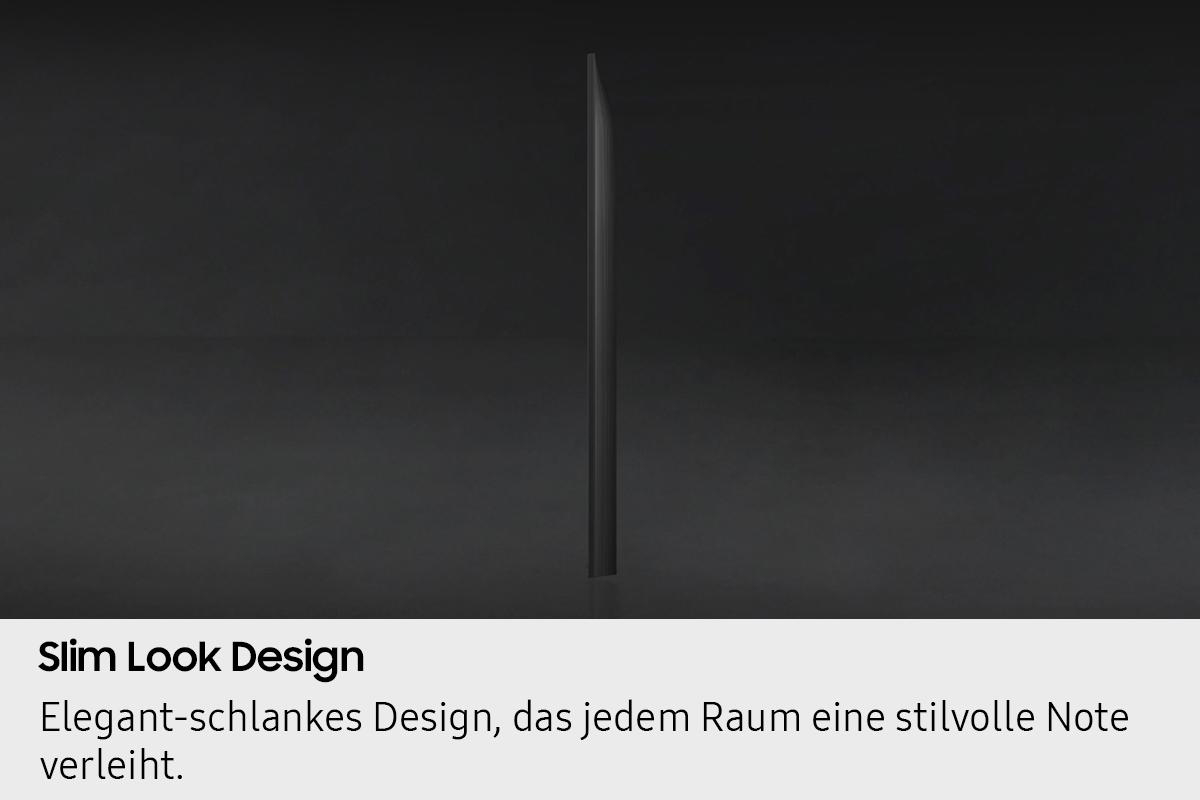 Ein schlankes, dunkles, vertikales Objekt, möglicherweise ein Fernseher, steht vor einem dunklen Hintergrund.