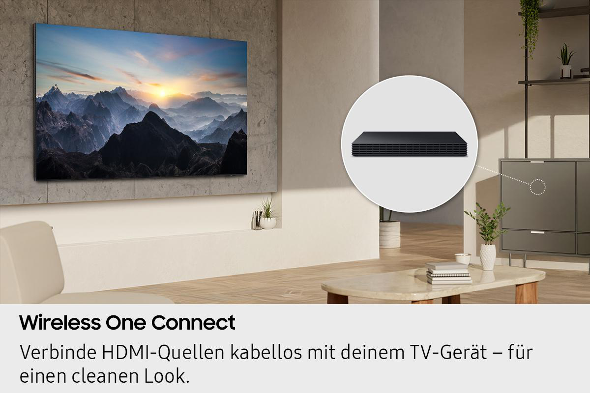 Ein Fernseher zeigt eine Berglandschaft. Ein schwarzes Gerät wird hervorgehoben. Der Text lautet: Wireless One Connect.