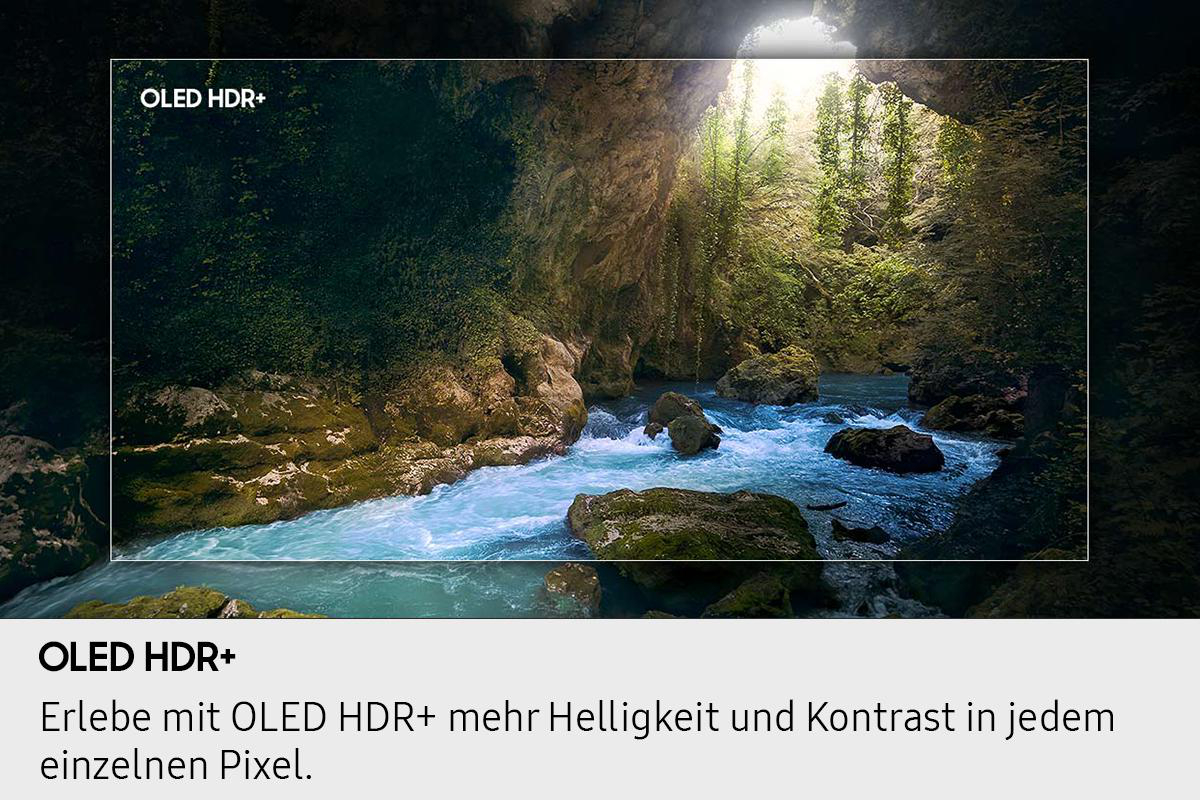 Ein Fluss fließt durch einen Canyon. Sonnenlicht scheint durch die obere Öffnung. Felsen und grüne Vegetation rahmen das Wasser ein.