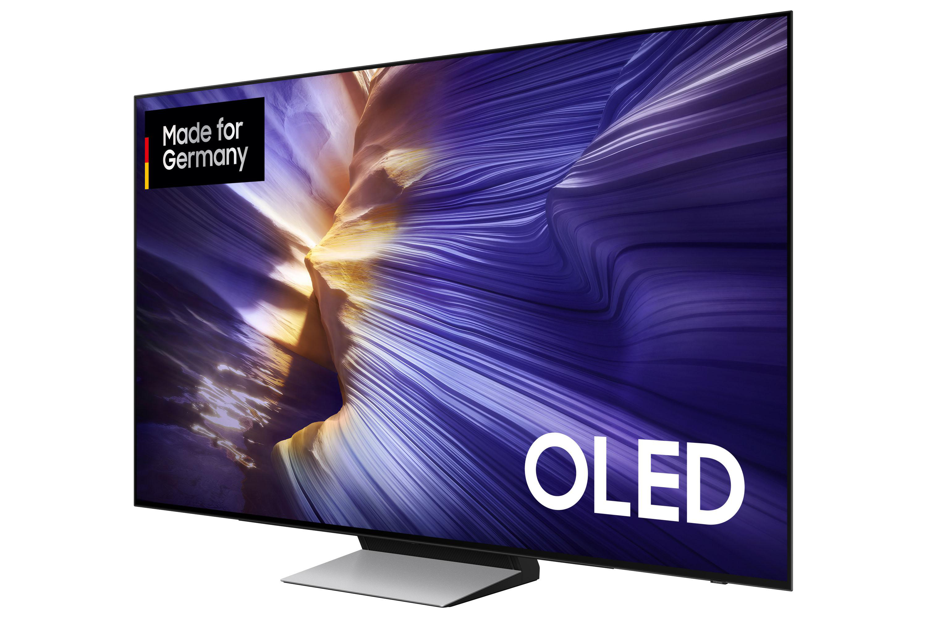 Ein moderner OLED-Fernseher mit farbenfrohem, abstraktem Hintergrund und dem Wort 'OLED'. Es ist mit 'Made for Germany' gekennzeichnet.