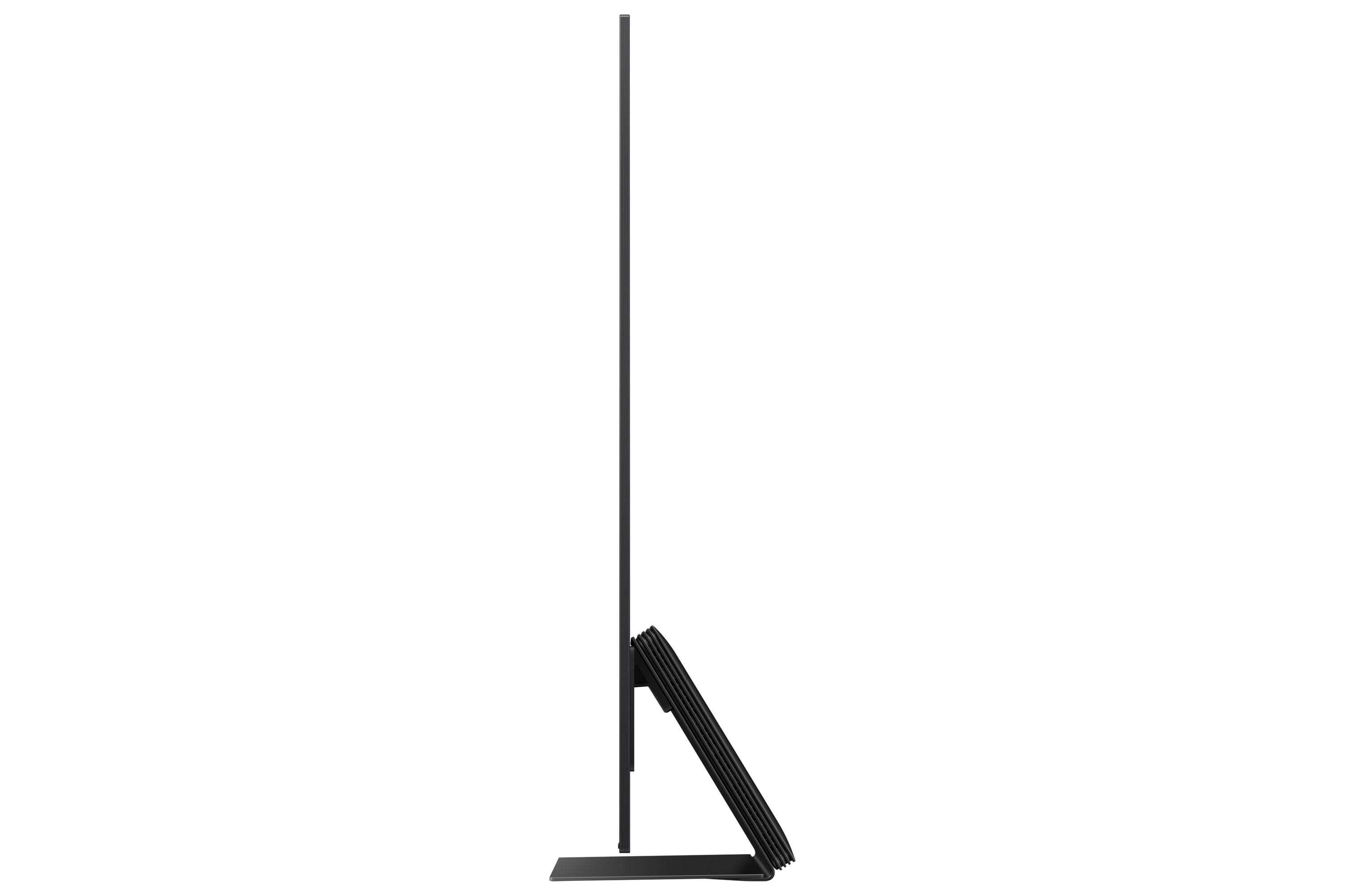 Seitenansicht eines schwarzen, dünnen Fernsehers auf weißem Hintergrund. Der Fernseher hat einen Ständer.