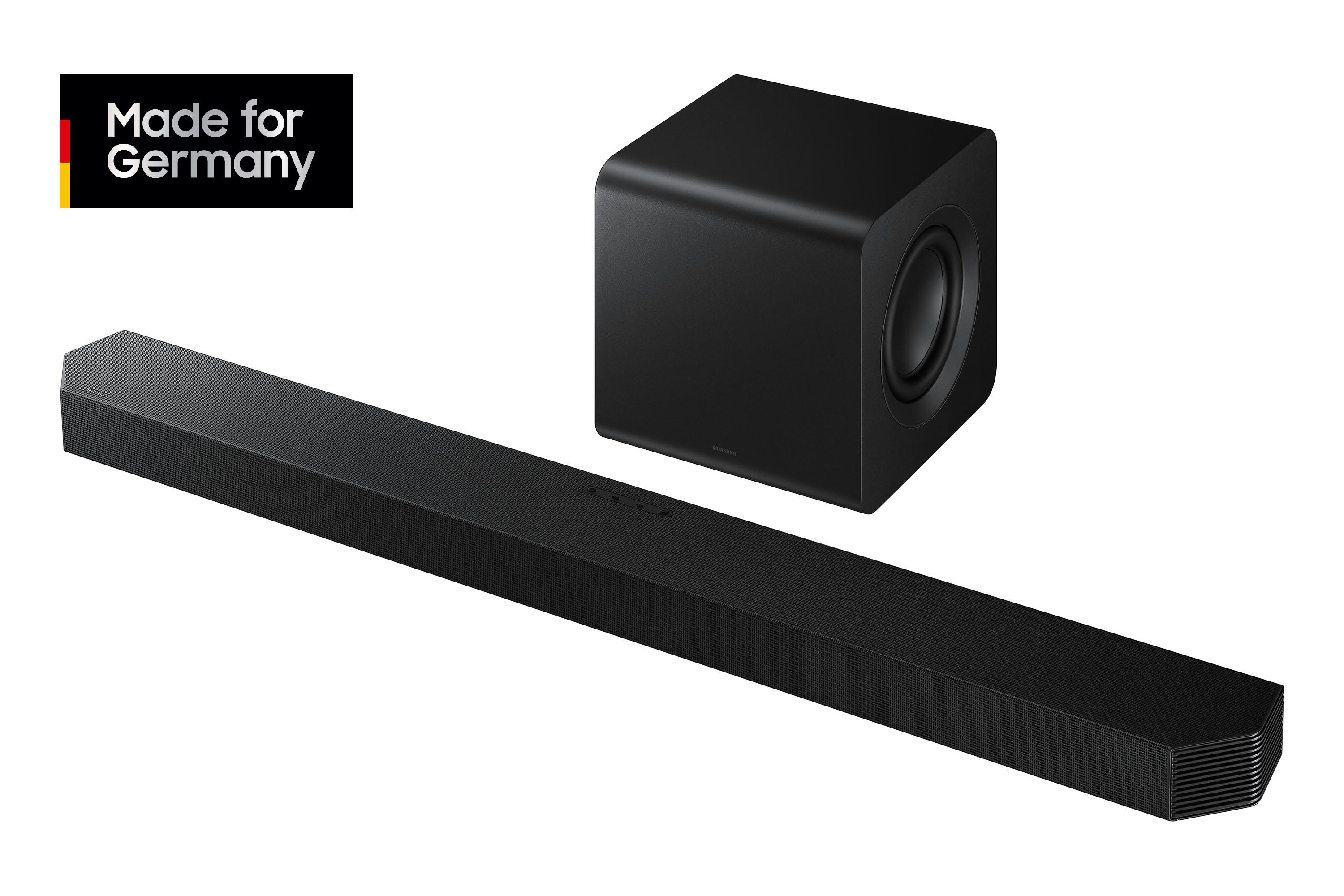 Schwarze Soundbar mit Subwoofer. Die Soundbar ist lang und rechteckig. Der Subwoofer ist ein schwarzer Würfel. Made for Germany Logo.