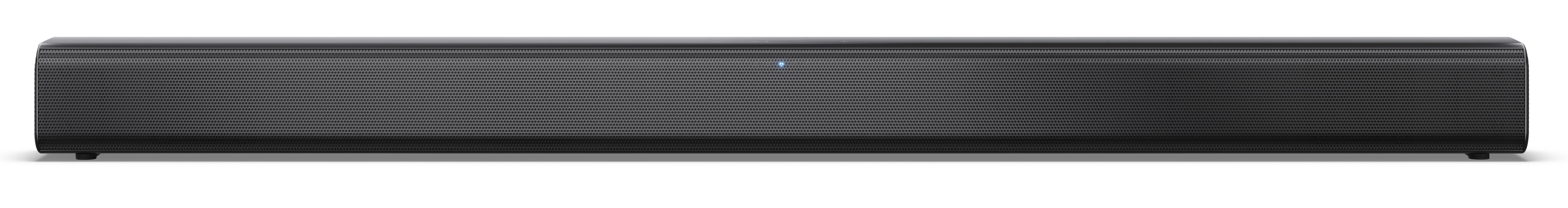 Czarny soundbar z perforowanym przodem. Niebieskie światło wskazuje, że jest włączony. Leży na białej powierzchni.