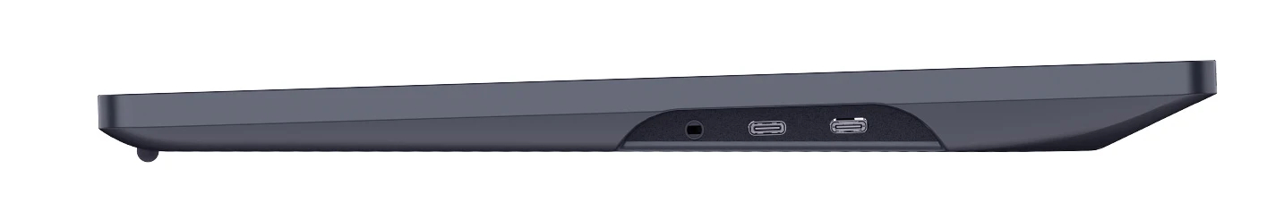 Ciemnoszare, kątowe urządzenie, prawdopodobnie klawiatura lub gładzik. Ma porty z boku, w tym USB-C i gniazdo słuchawkowe.