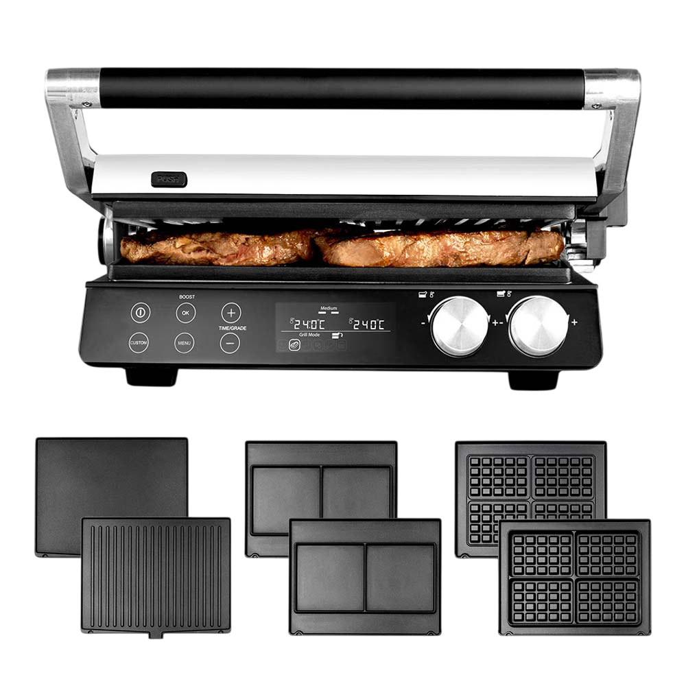 Ein Elektrogrill mit darin kochenden Steaks. Mehrere austauschbare Platten darunter, darunter Waffel- und Grillformen.
